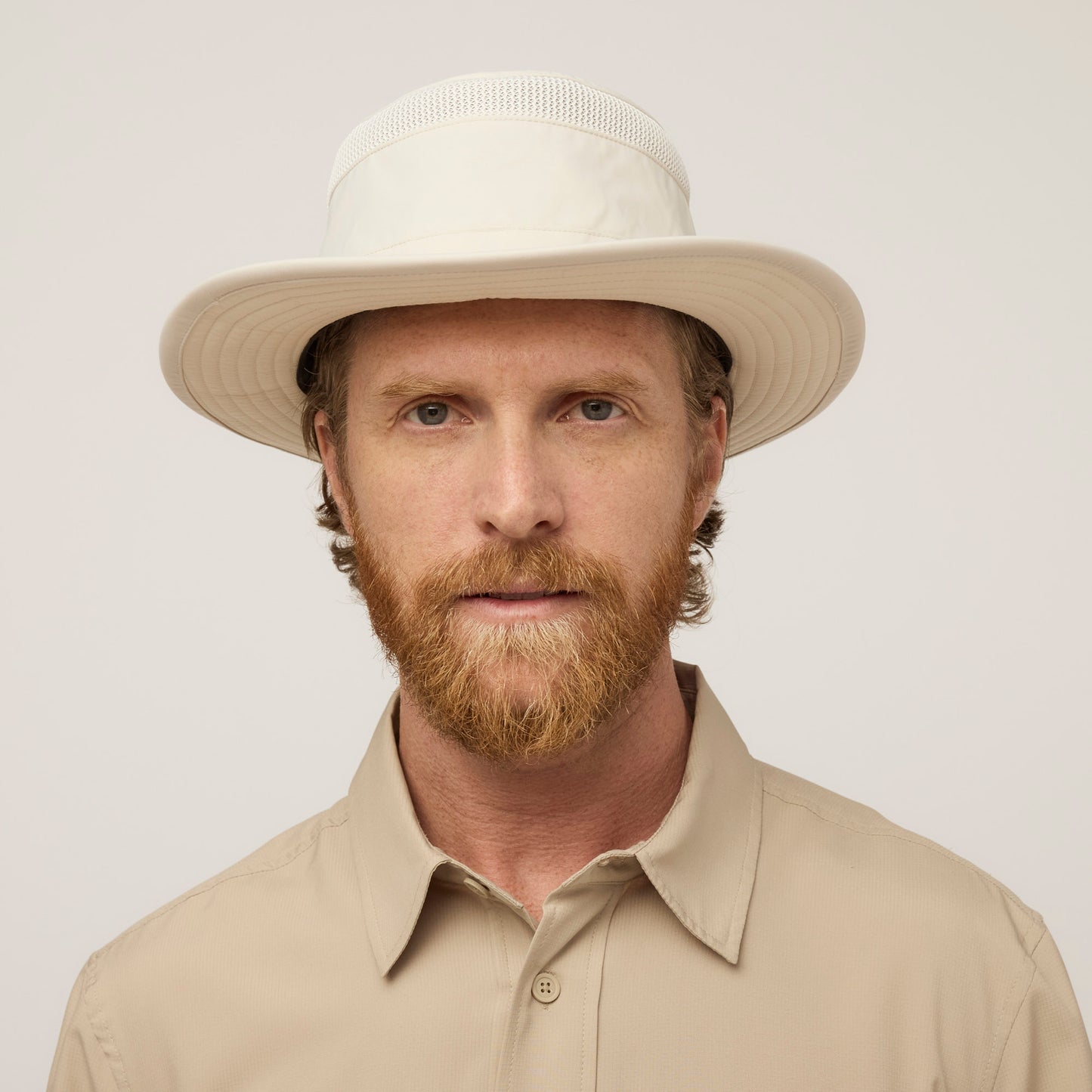 Man with a red beard in a beige shirt and Tilley Airflo® Boonie Hat, facing the camera.