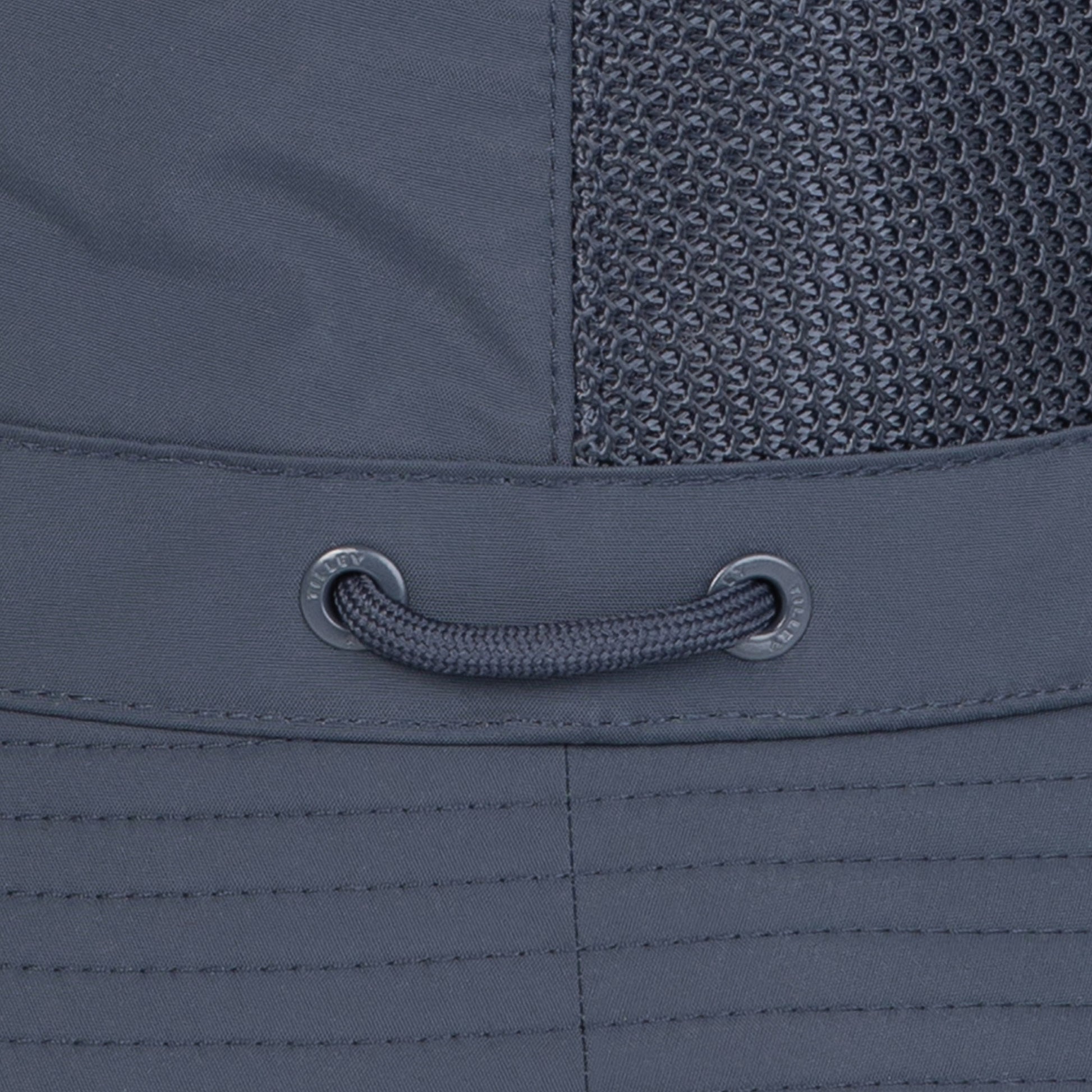 Close-up of a gray Tilley LTM1 Airflo® Bucket Hat with mesh panel and navy adjustable drawstring.