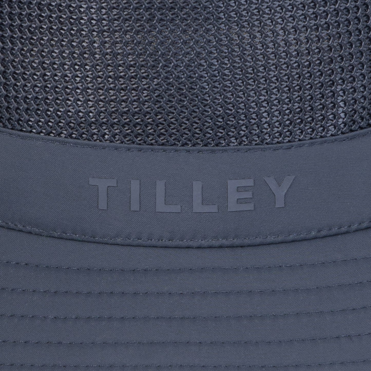 Close-up of a navy Tilley LTM1 Airflo® Bucket Hat with mesh panels for breathability.