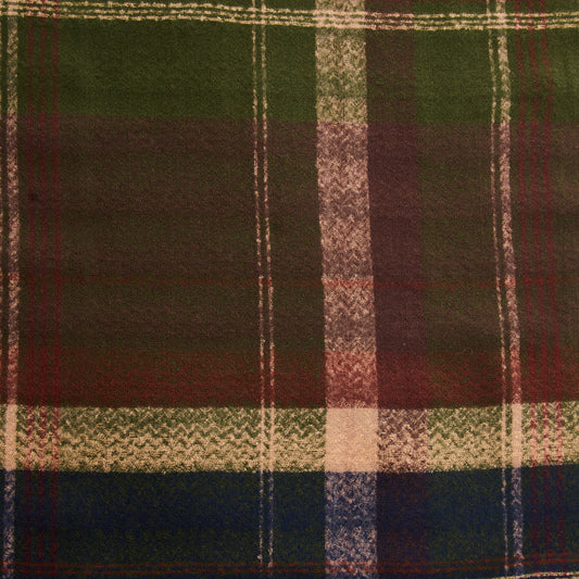Product Image – Howard’s Green Plaid Fringe Scarf in buttery soft green, red, and navy blue tartan plaid with a textured pattern.