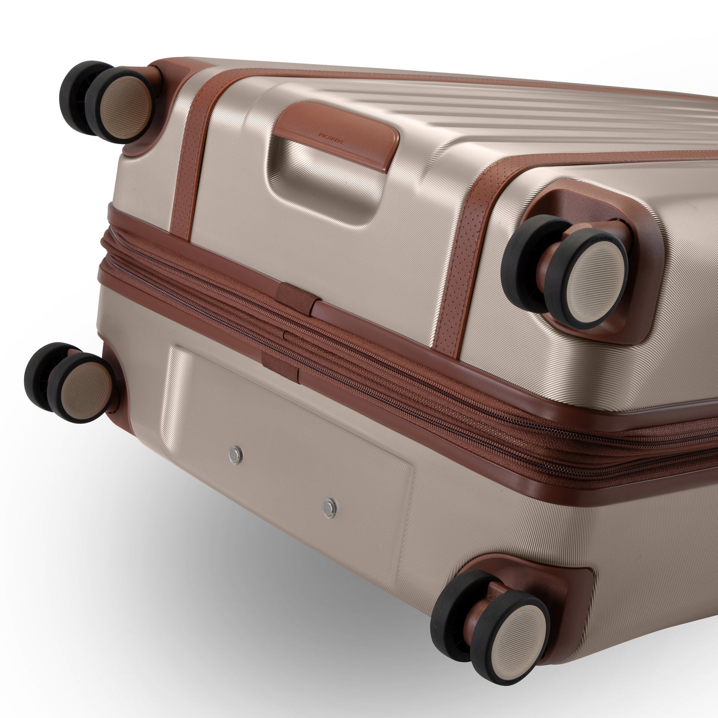 Ricardo Beverly Hills Montecito 2.0 29" hardside spinner, beige with brown trim and four swivel wheels.