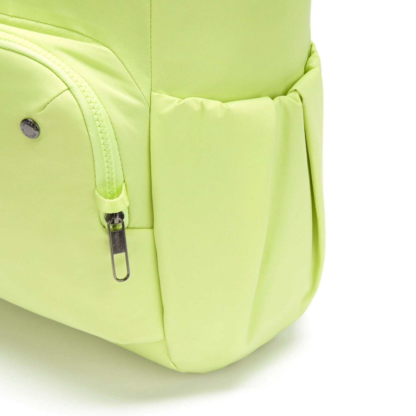 Close-up of a matcha green Pacsafe® CX Anti-theft 17L Backpack's zipper pocket and side pocket, on white background.