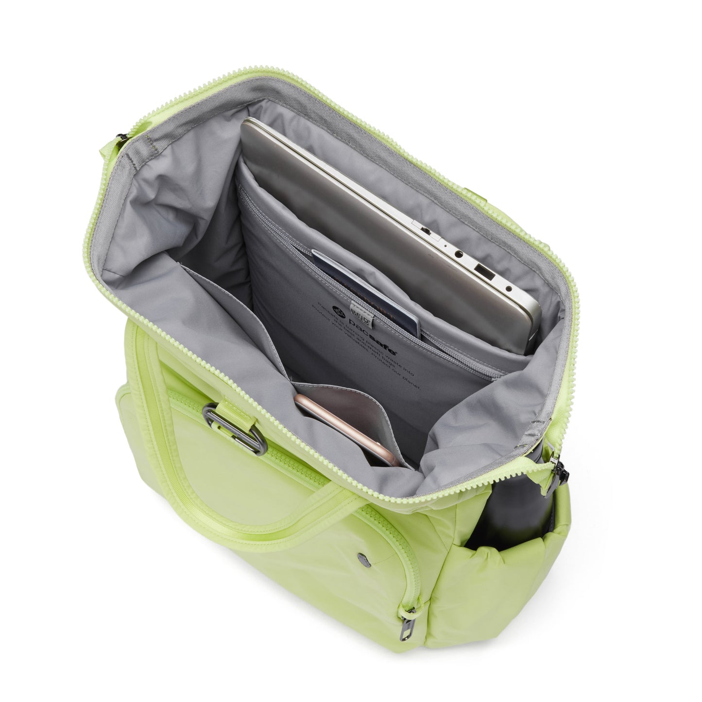 Open view of matcha green Pacsafe® CX 17L Backpack with recycled polyester, anti-theft design holds a laptop and smartphone.