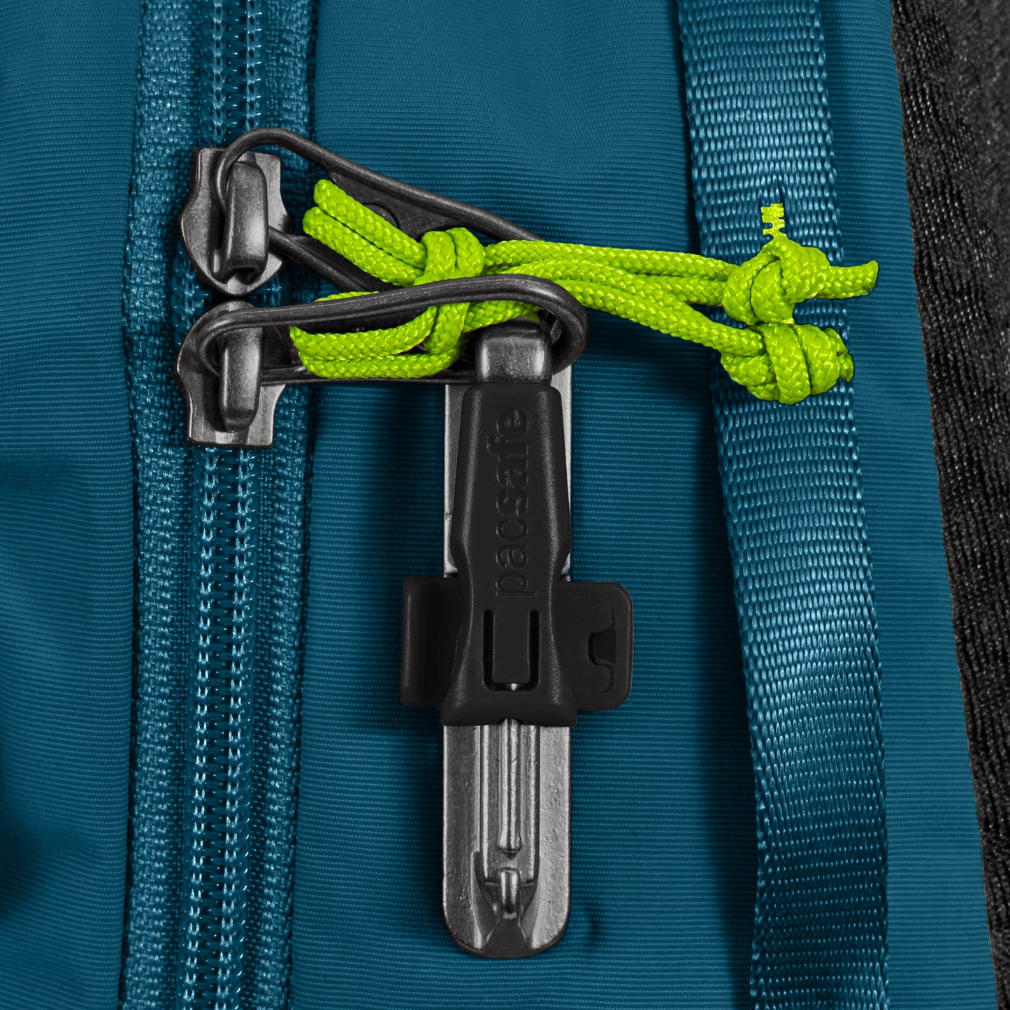 Close up of Pacsafe® ECO 12L Anti-theft Sling Backpack zipper pulls with green cord