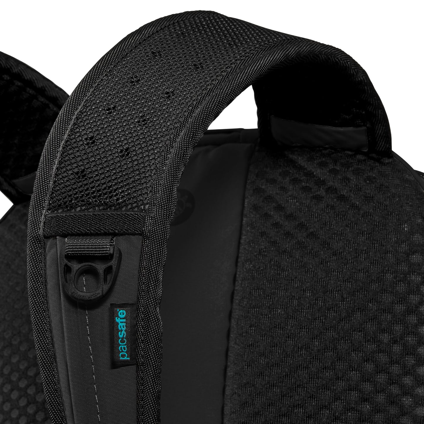 Close-up of a textured black strap on the Pacsafe® ECO 25L Anti-theft Backpack with a small blue Pacsafe label.