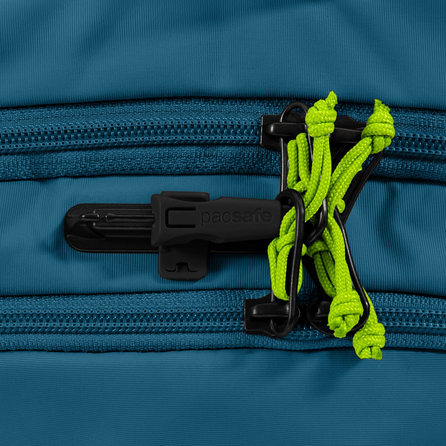 Close-up of the Pacsafe® ECO 25L Anti-theft Backpack's blue zipper with a black lock and bright green cords.