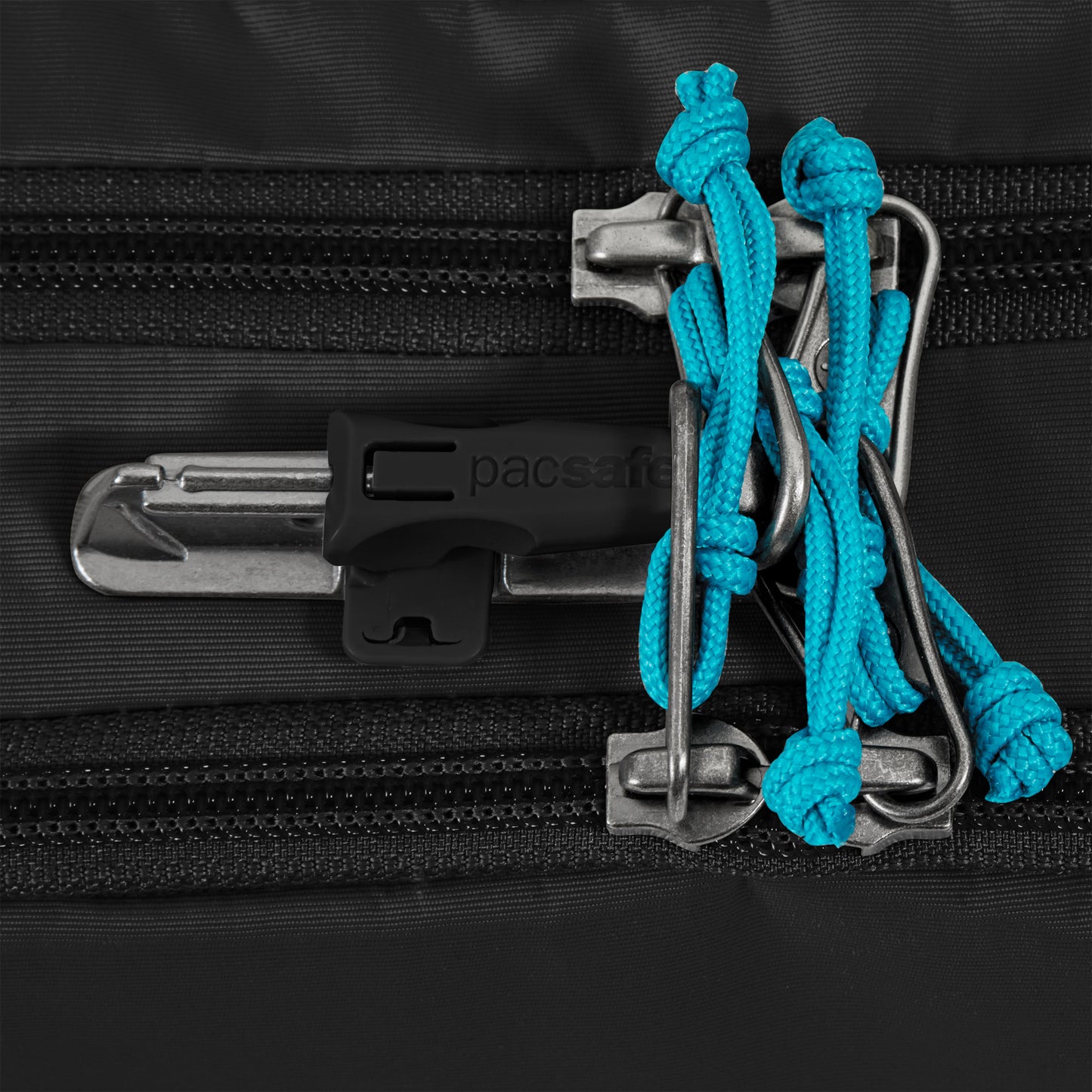 Close-up of Pacsafe® ECO waist pack security zipper lock, featuring blue cords and recycled materials.