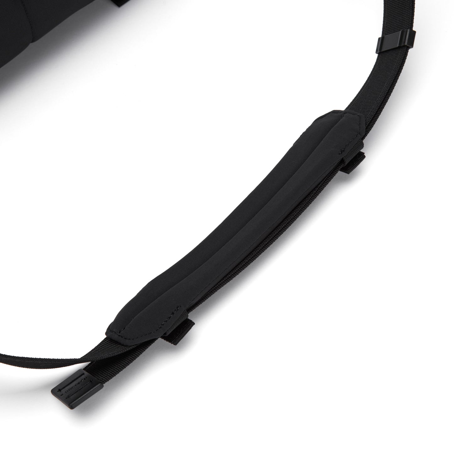Close-up of the black padded adjustable shoulder strap on the Pacsafe® EXP 12 Anti-theft Sling Crossbody bag.