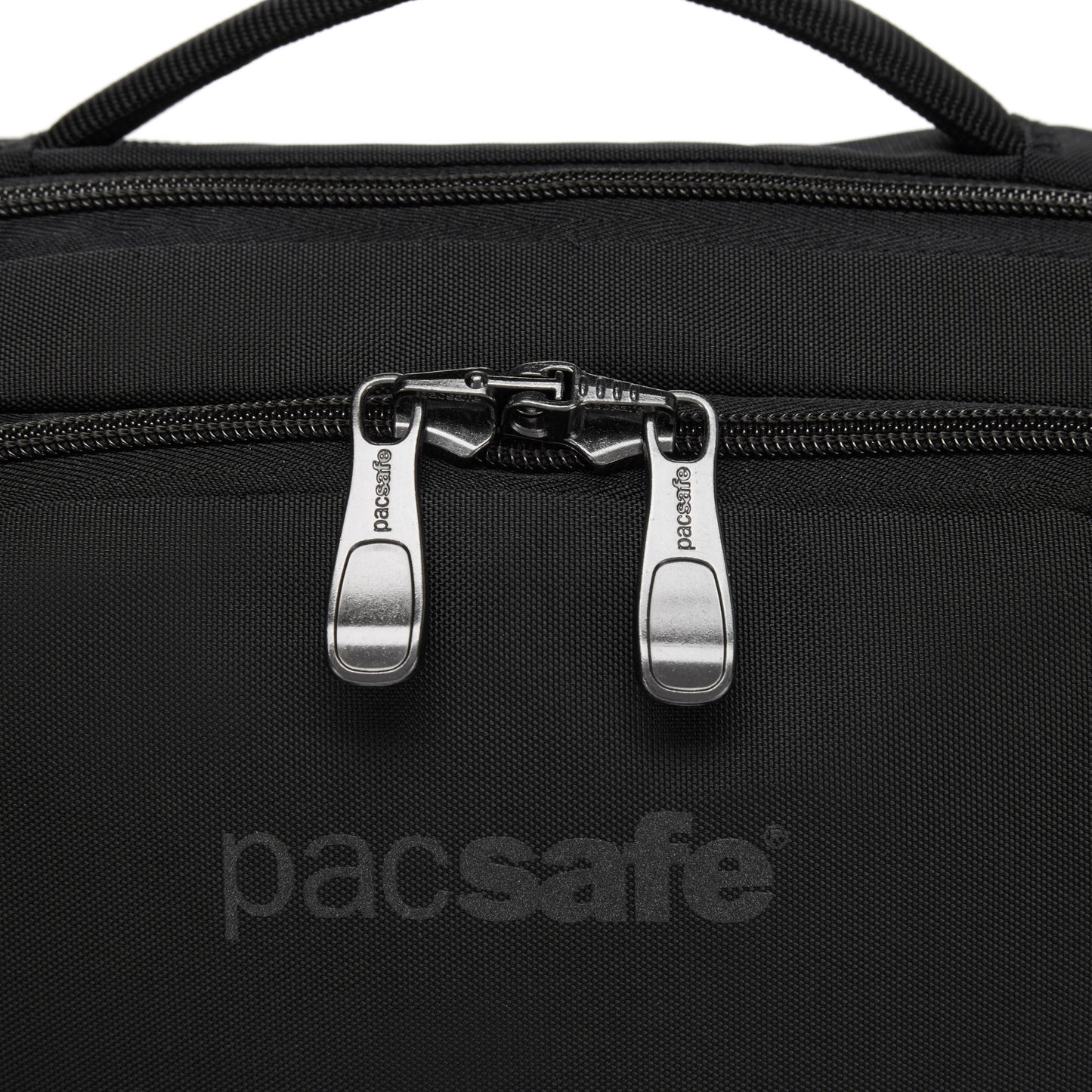 Close-up of a black Pacsafe® EXP 12 Sling Crossbody in recycled polyester, featuring two silver zippers and branding.