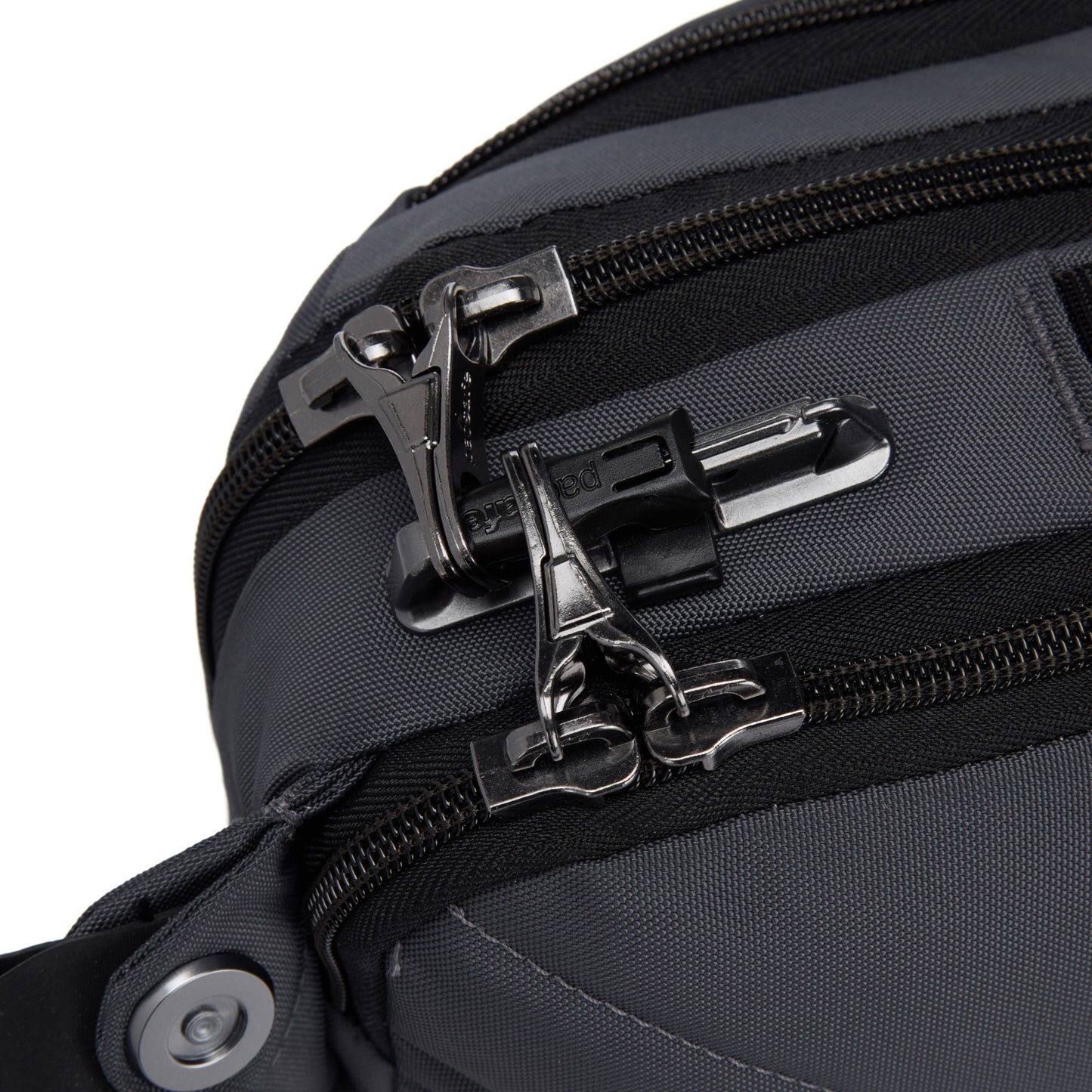 Close up of lockable zippers on the slate Pacsafe® EXP 12 Anti-theft Sling Crossbody