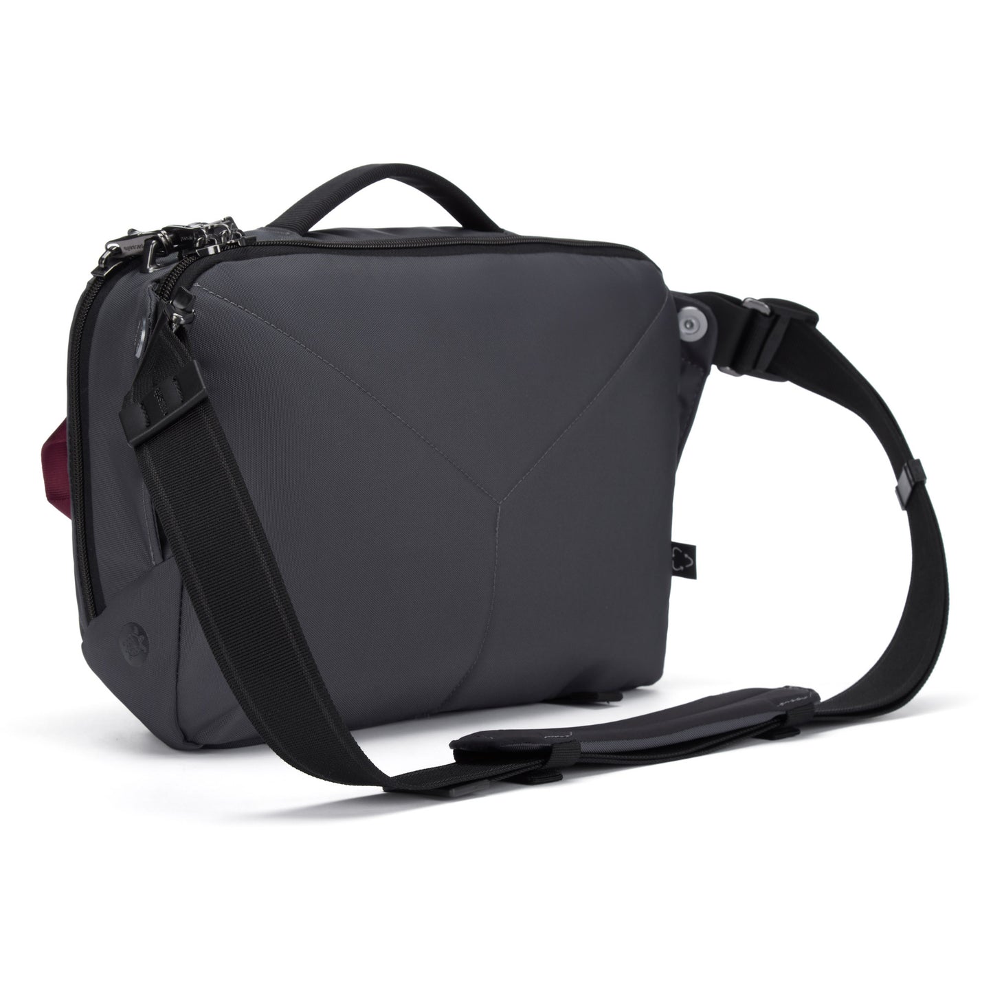 Back angled view of Pacsafe® EXP 12 Crossbody in slate, geometric bag with recycled polyester, black strap, and top handle.