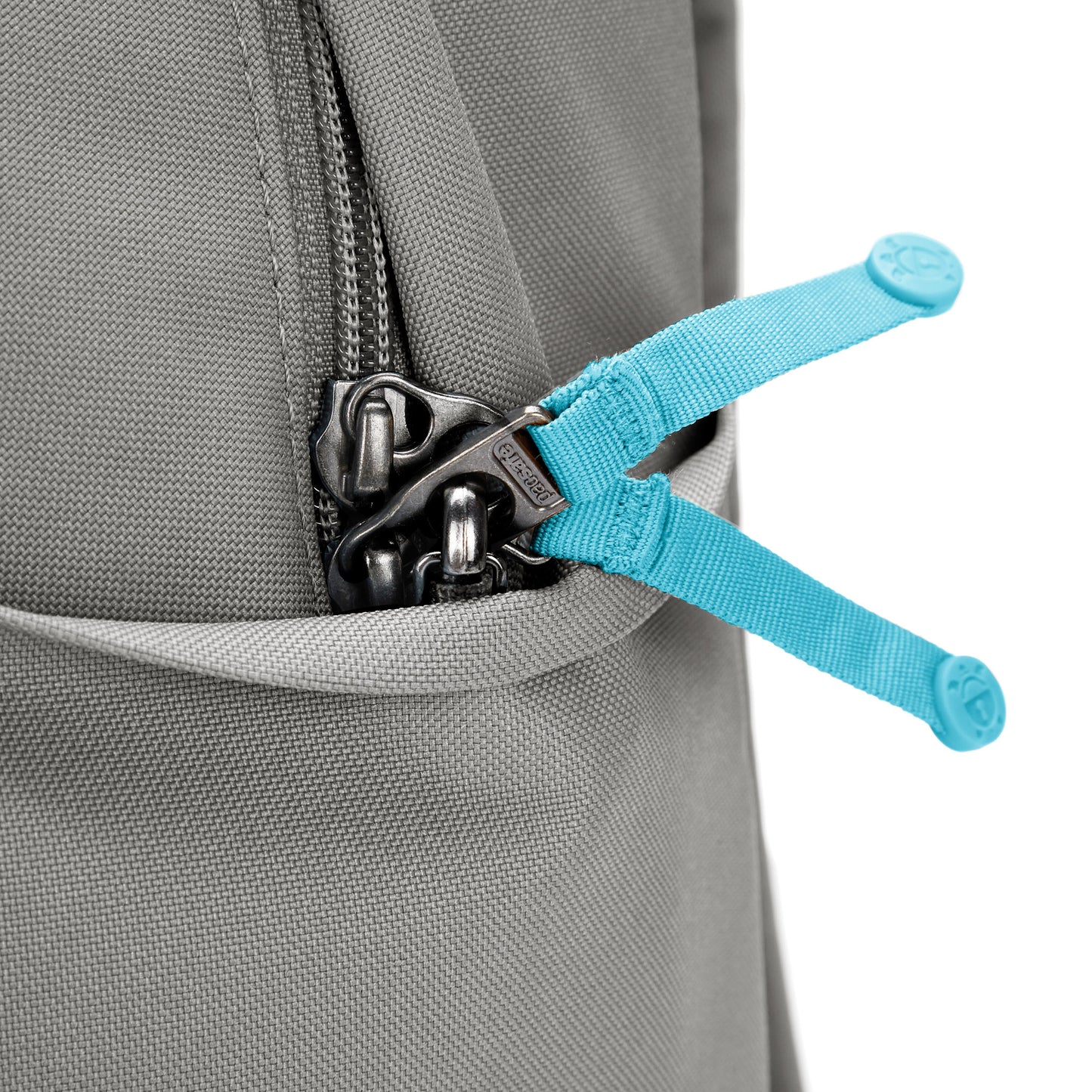 Close up of turquoise zipper pulls on stone colour Pacsafe® Go 15L Anti-theft Backpack