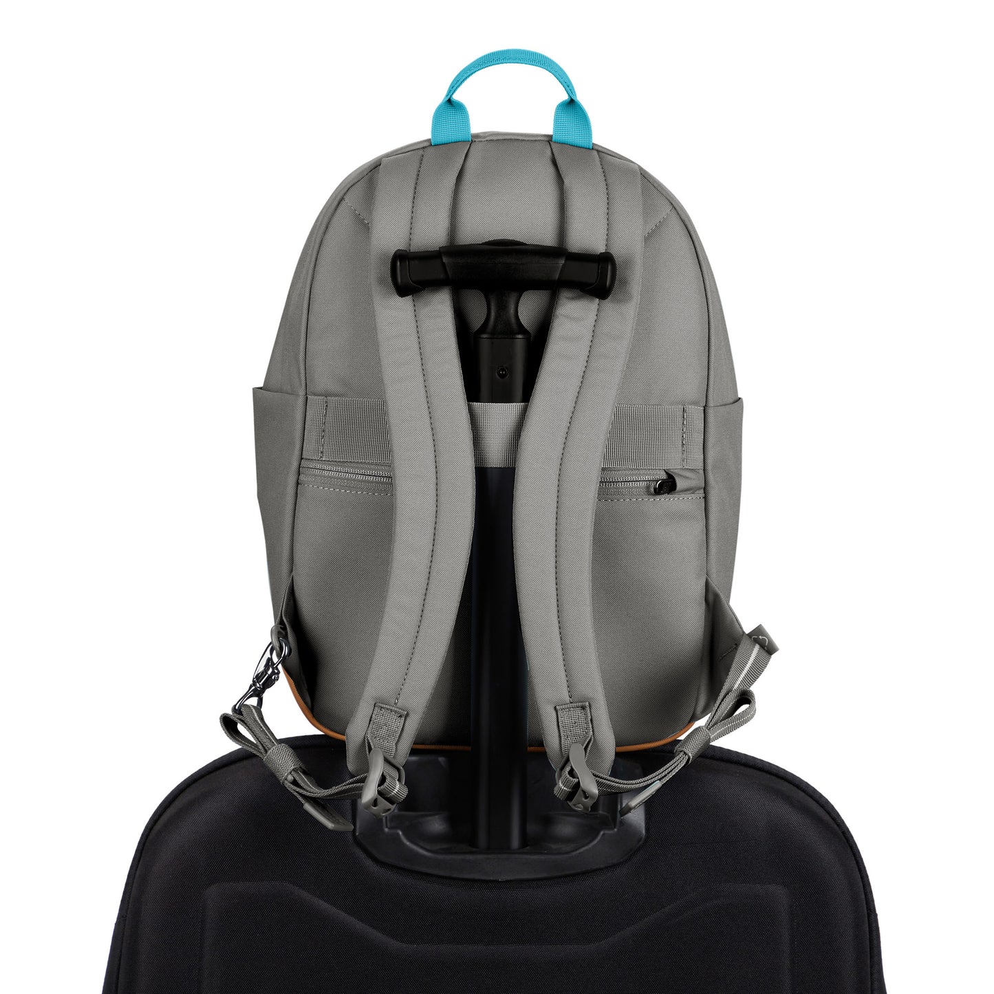 Pacsafe® Go 15L Anti-theft Backpack in stone colour secured onto the extended handle of a full sized wheeled luggage.