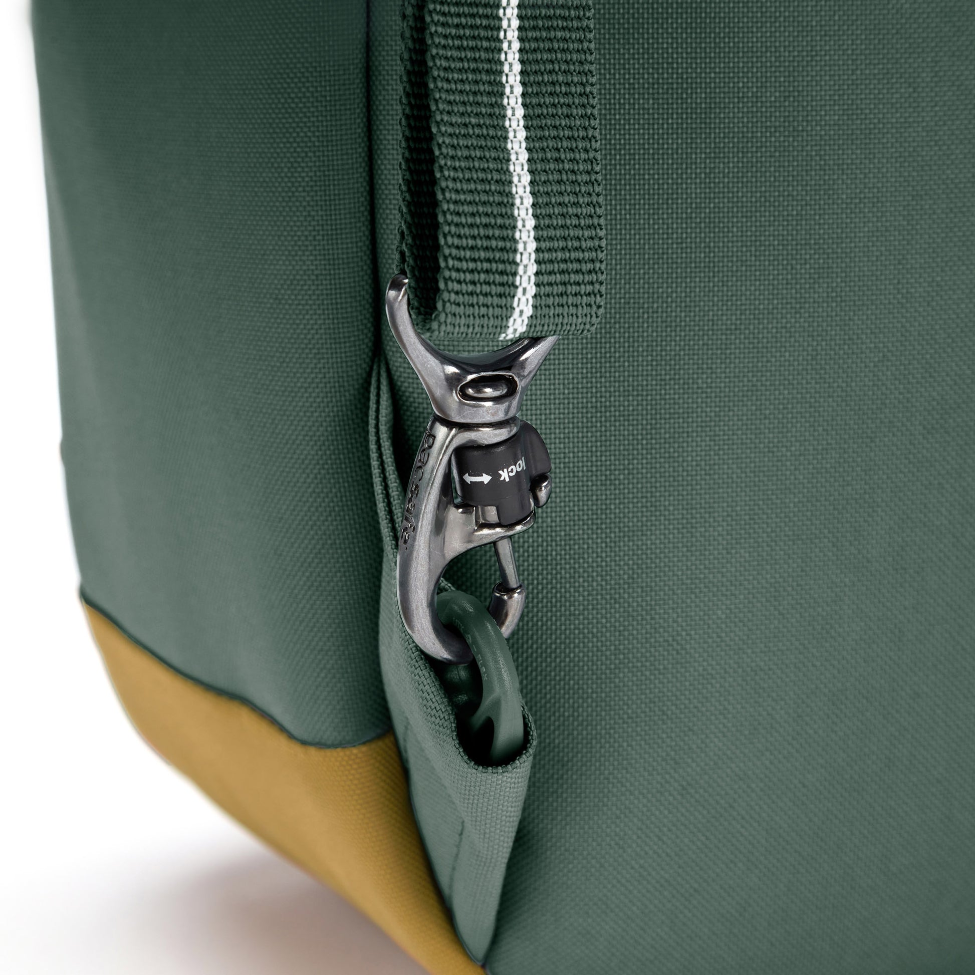 Close up of twist n lock strap on spruce green backpack
