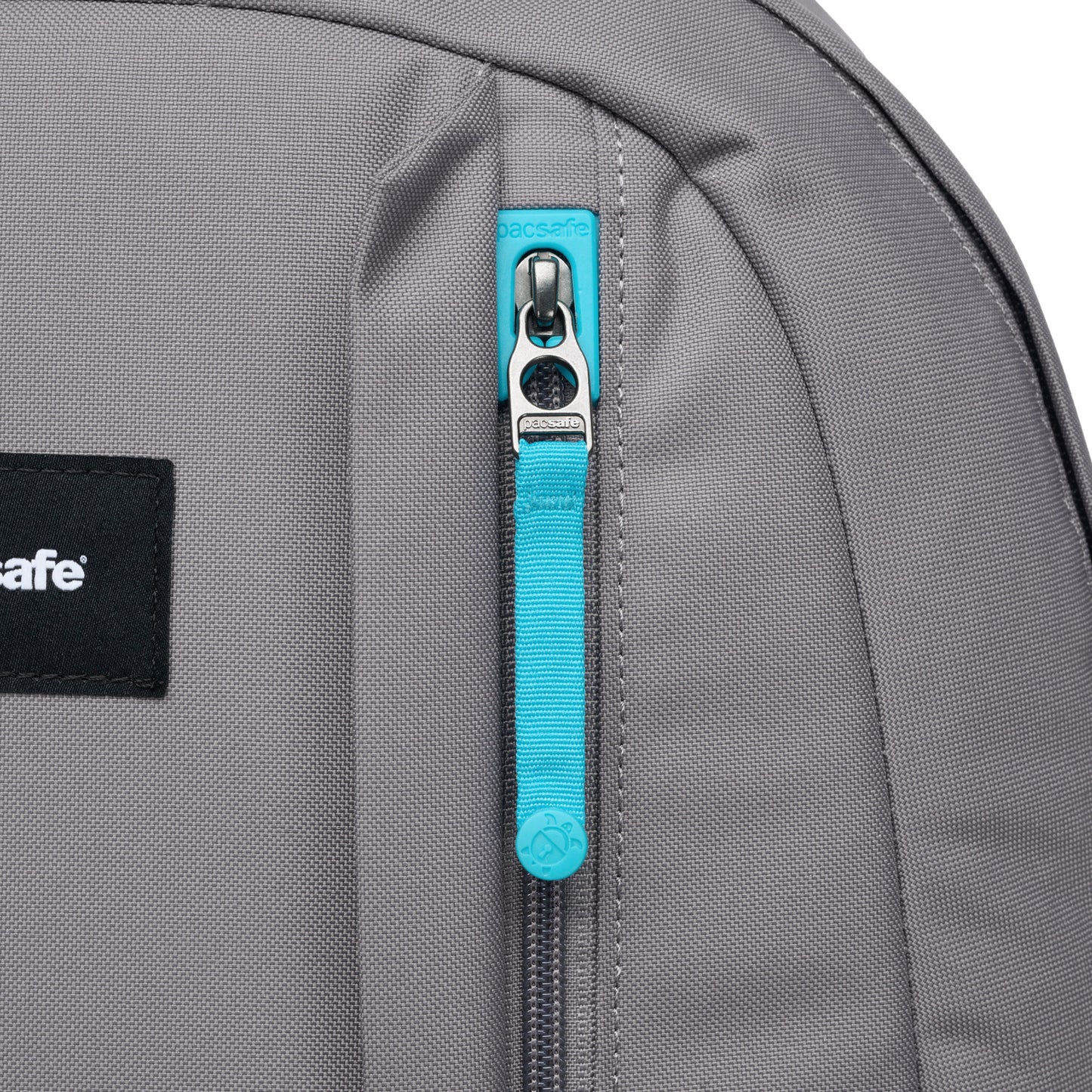 Close up of front zippered pocket with turquoise zipper pull.
