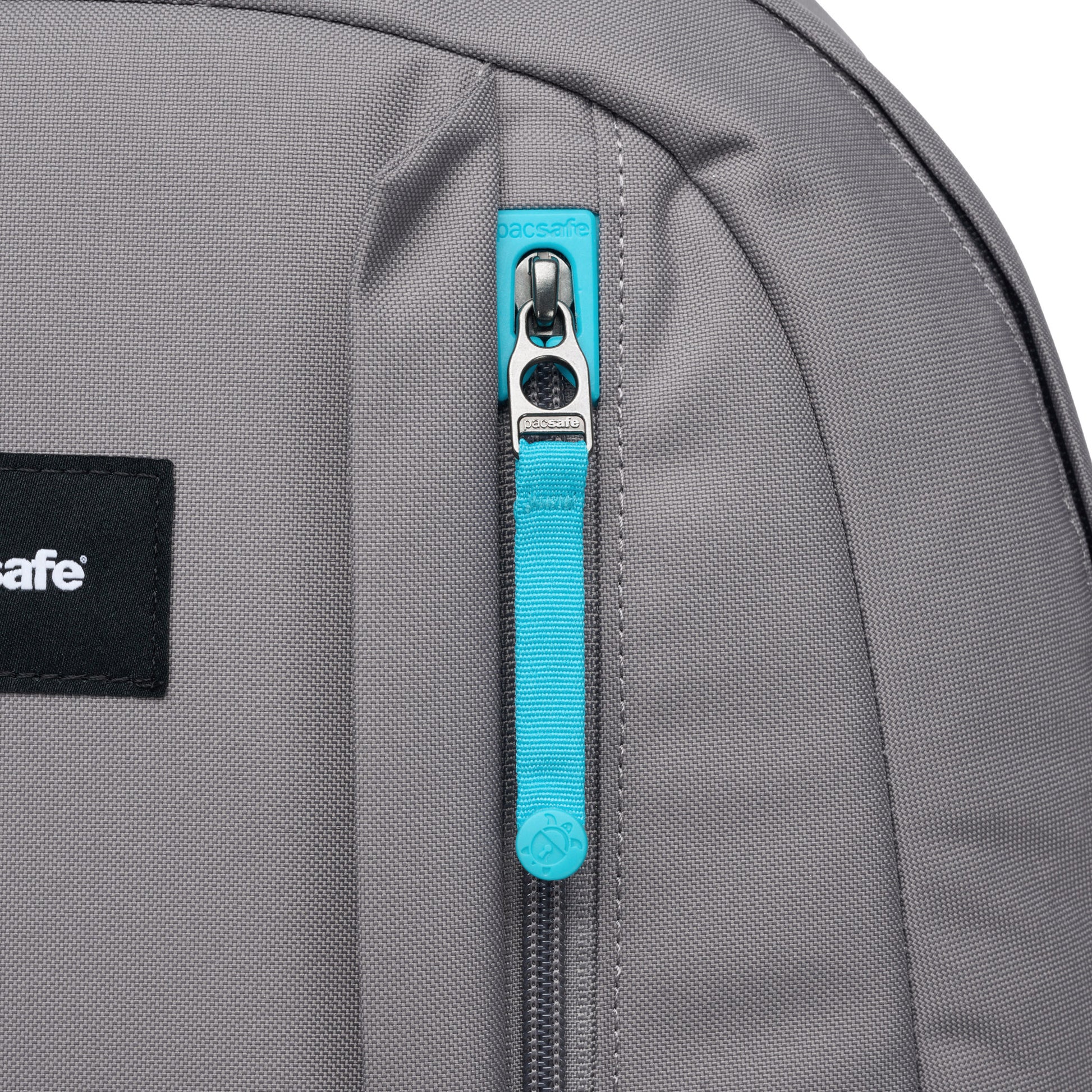 Close up of front zippered pocket with turquoise zipper pull.