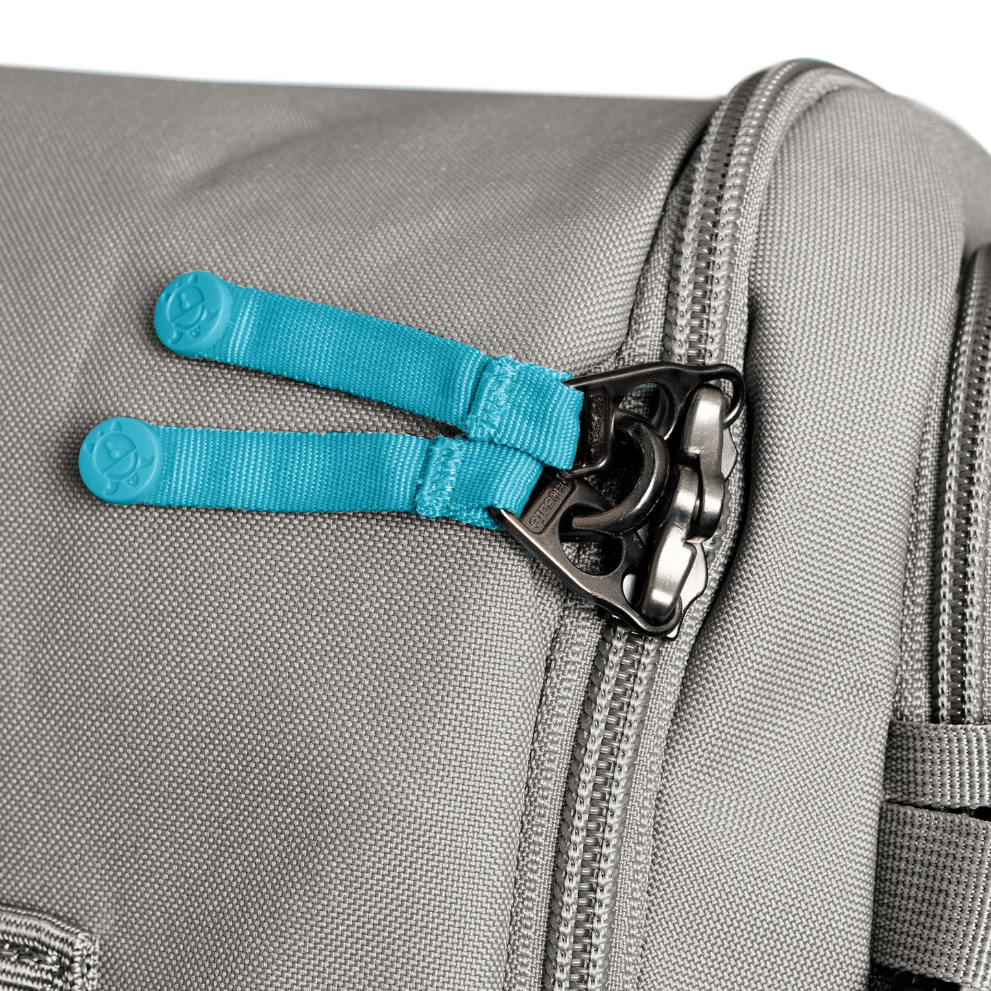 Close-up of the Pacsafe® GO 34L Anti-theft Carry-on Backpack with lockable main compartment and blue zipper pulls.