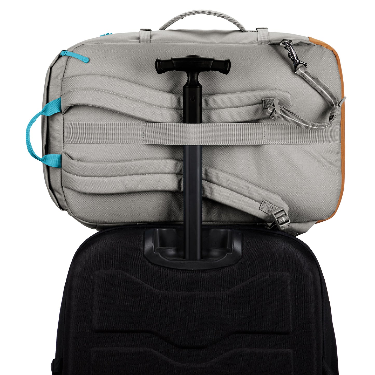 The Pacsafe® GO 44L in gray, with RFID blocking, sits securely on a black suitcase.
