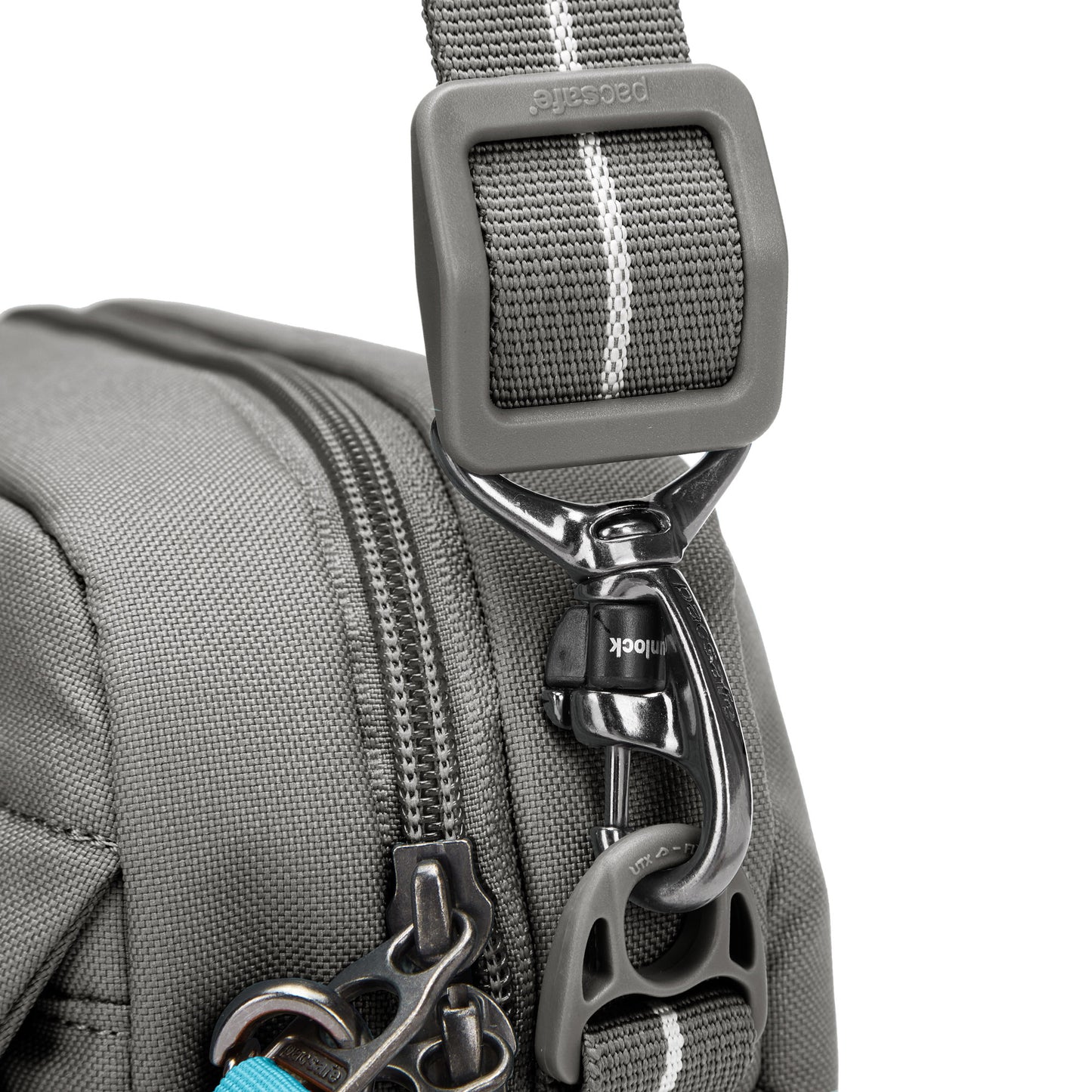 Close up of turn n lock clip on crossbody strap of stone Pacsafe® GO Anti-Theft Crossbody Bag