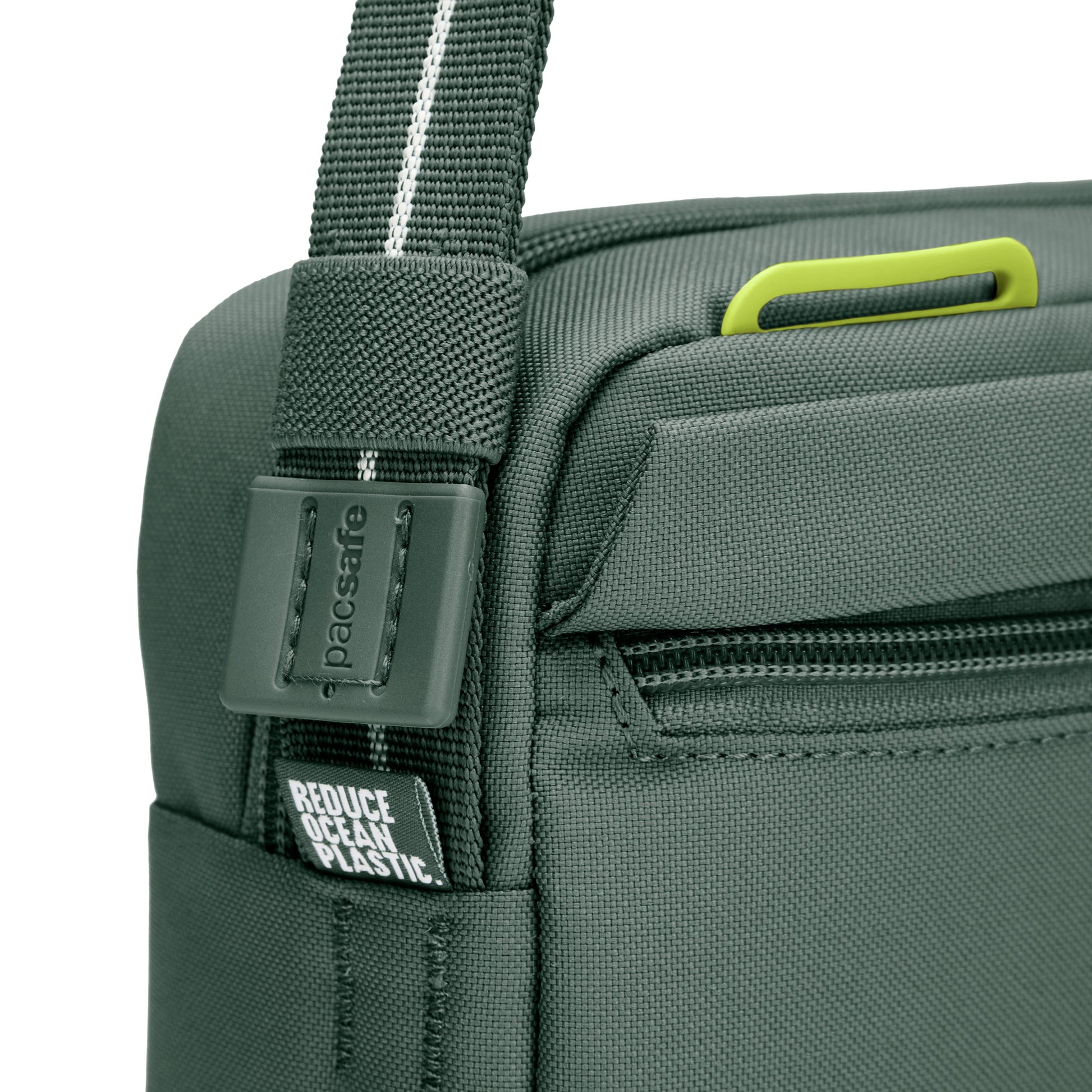 Close up of adjustable crossbody strap on spruce green Pacsafe® GO Anti-Theft Crossbody Bag