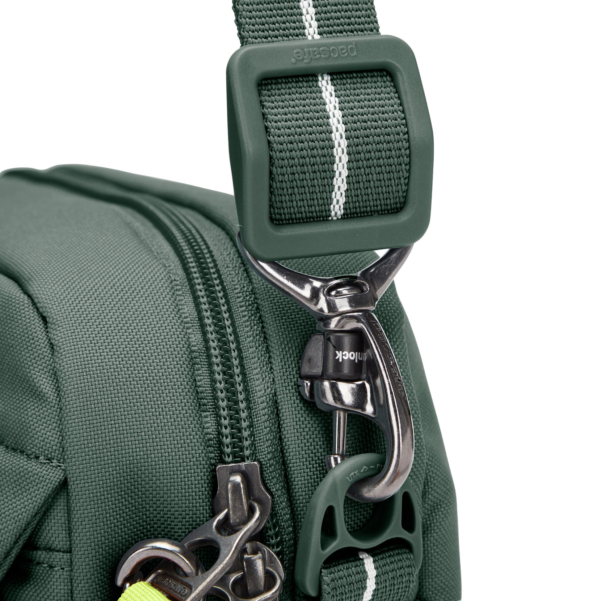 Close up of turn n lock clip on crossbody strap of spruce green Pacsafe® GO Anti-Theft Crossbody Bag