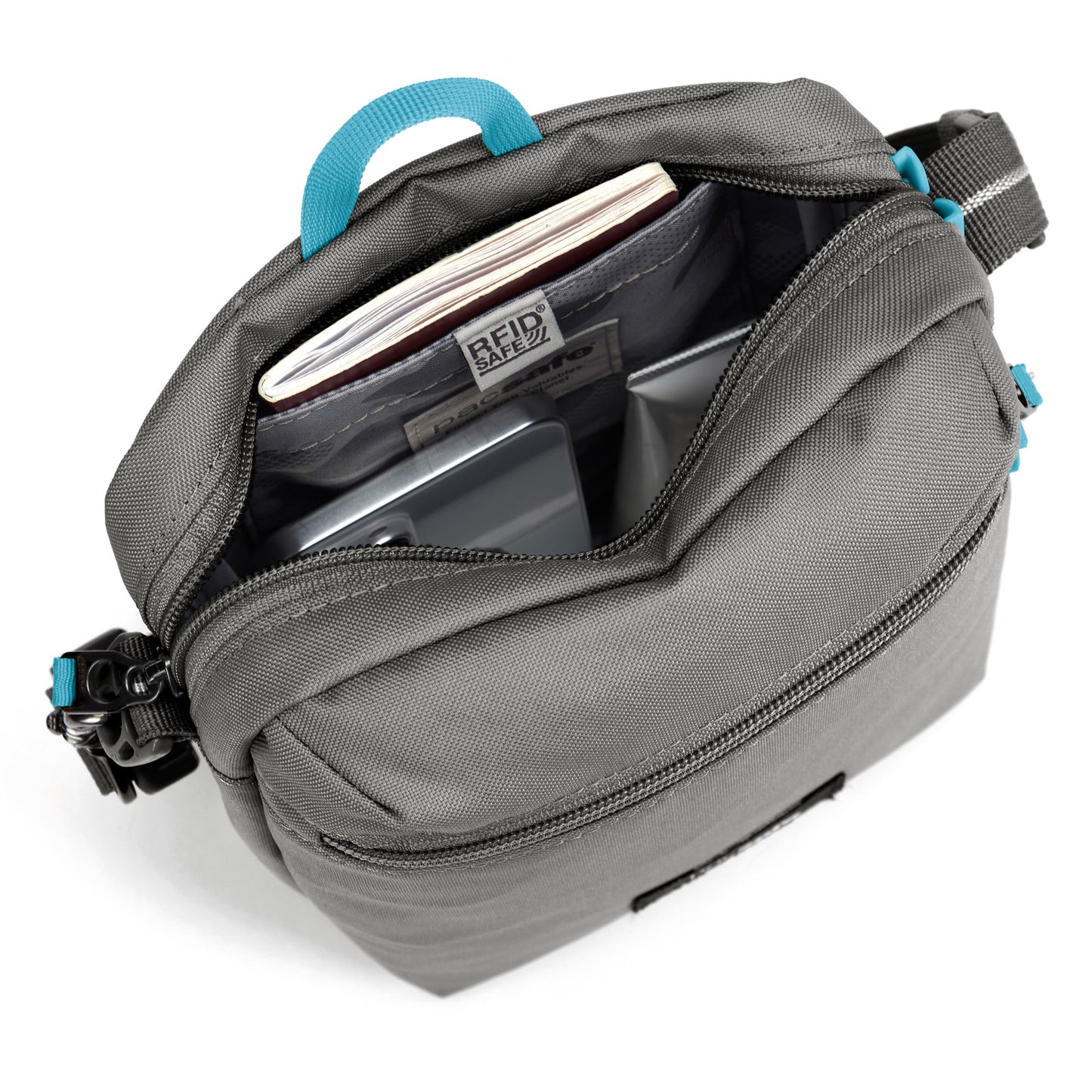 Pacsafe® GO Anti-Theft Festival Crossbody, stone, inside view with phone and passport in RFID pocket.