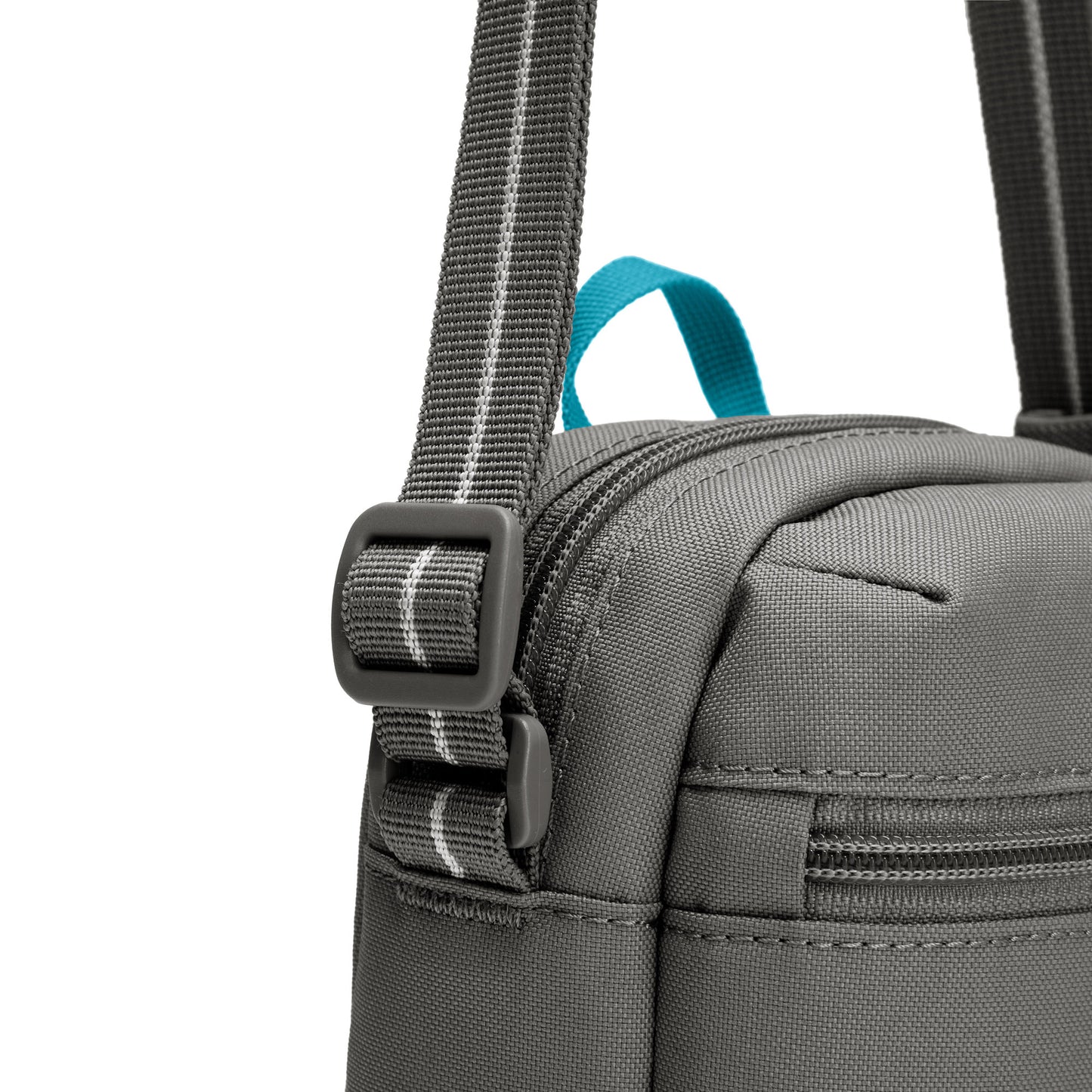 Close up of adjustable crossbody strap on the stone Pacsafe® GO Anti-Theft Micro Crossbody