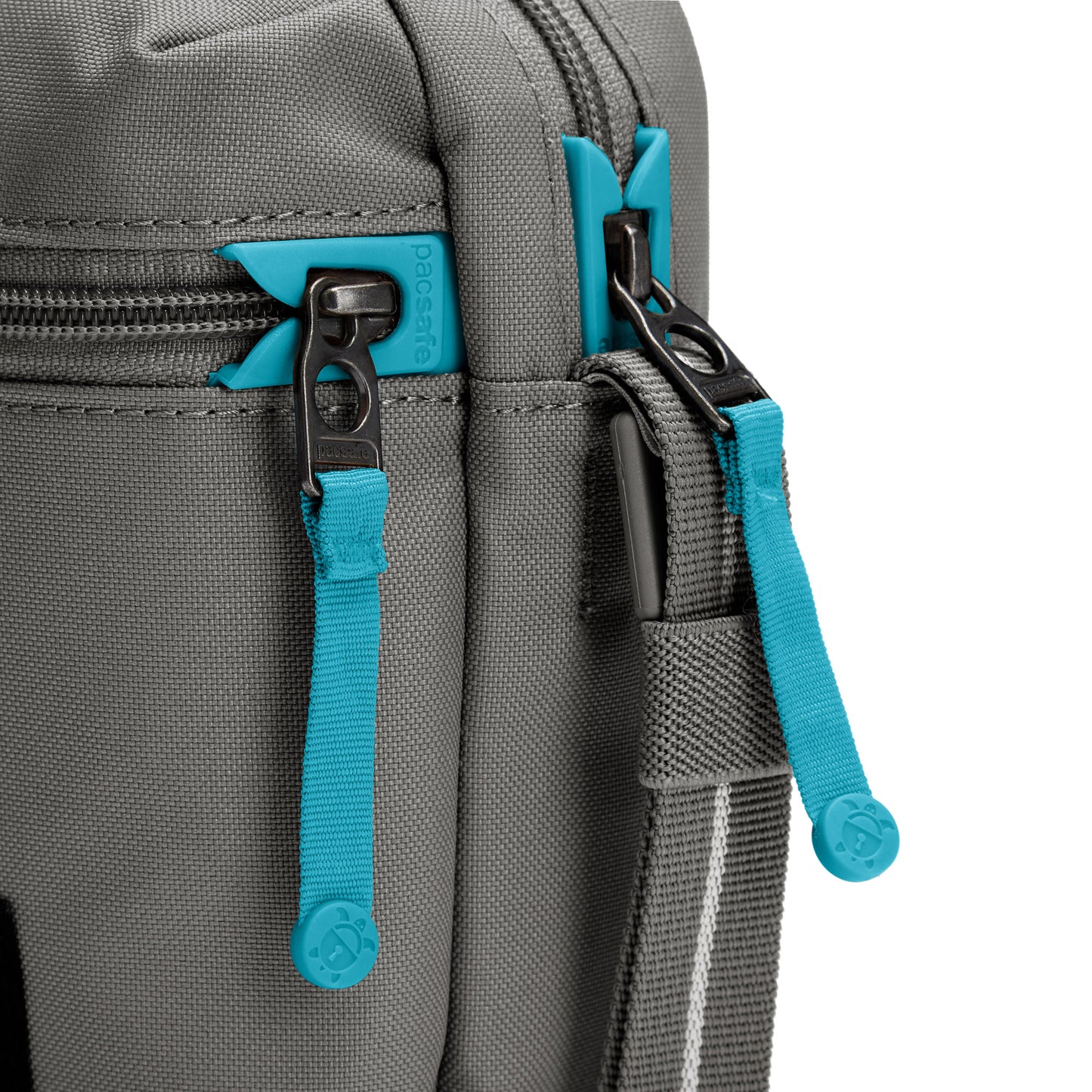 Close up of turquoise zipper pulls and lockable zippers on the stone Pacsafe® GO Anti-Theft Micro Crossbody