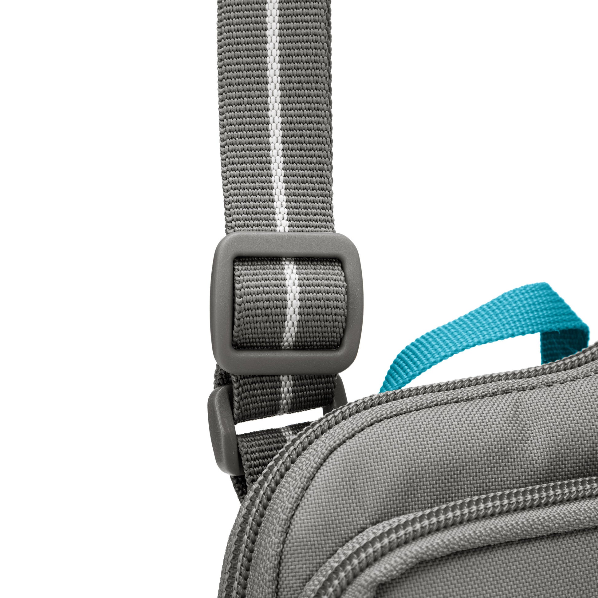Close up of adjustable crossbody strap on stone Pacsafe® GO Anti-Theft Tech Crossbody