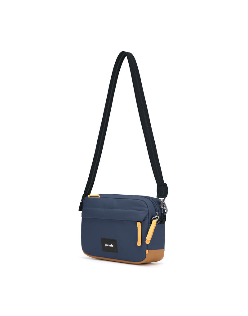 Pacsafe® GO Anti-Theft Crossbody Bag in coastal blue colour front right side view with Carrysafe® slashguard strap extended.