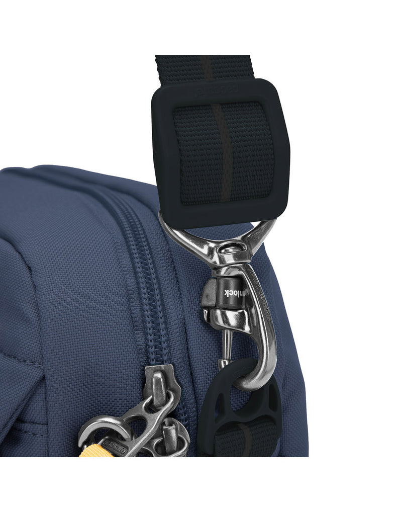 Pacsafe® GO Anti-Theft Crossbody Bag in coastal blue close up of shoulder strap attached to bag with the TurnNLock security hook.