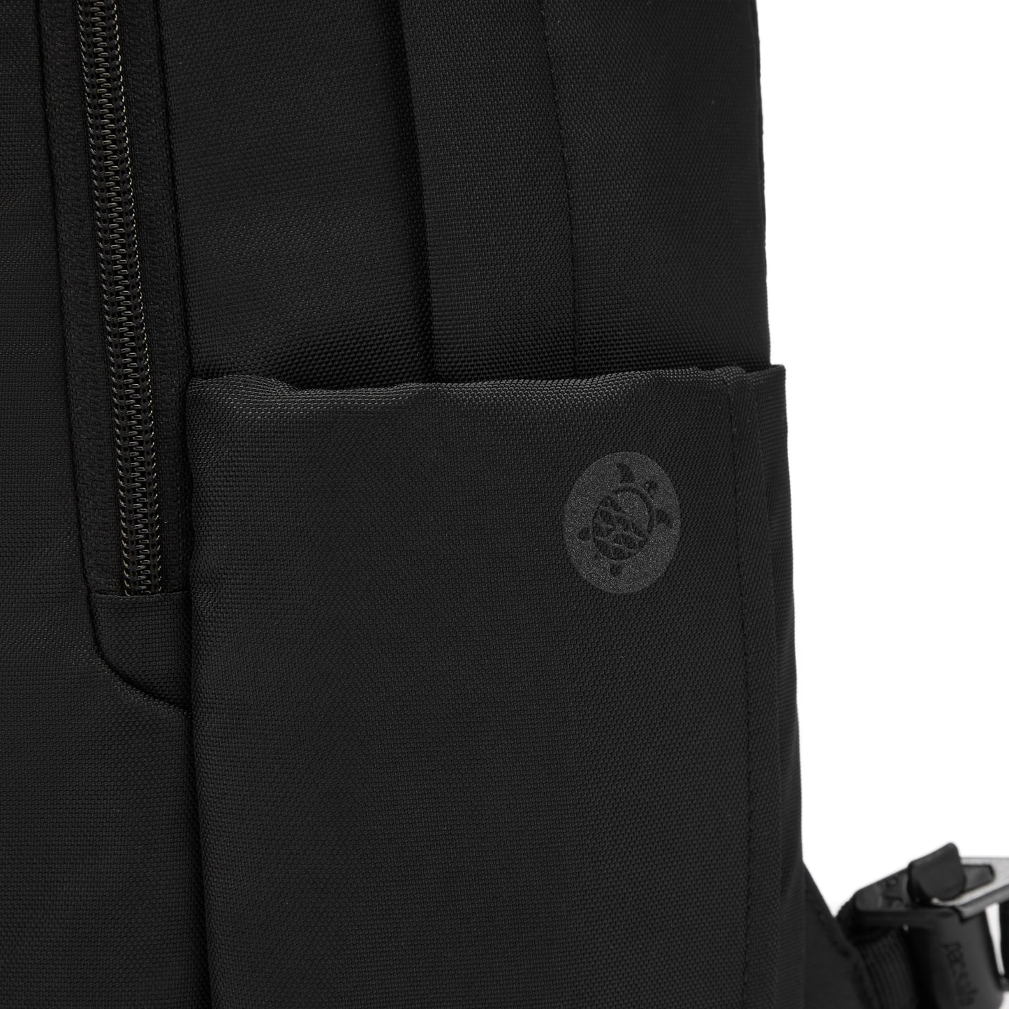 Close up of side water bottle pocket of the black Pacsafe V 16L All-Around Backpack.