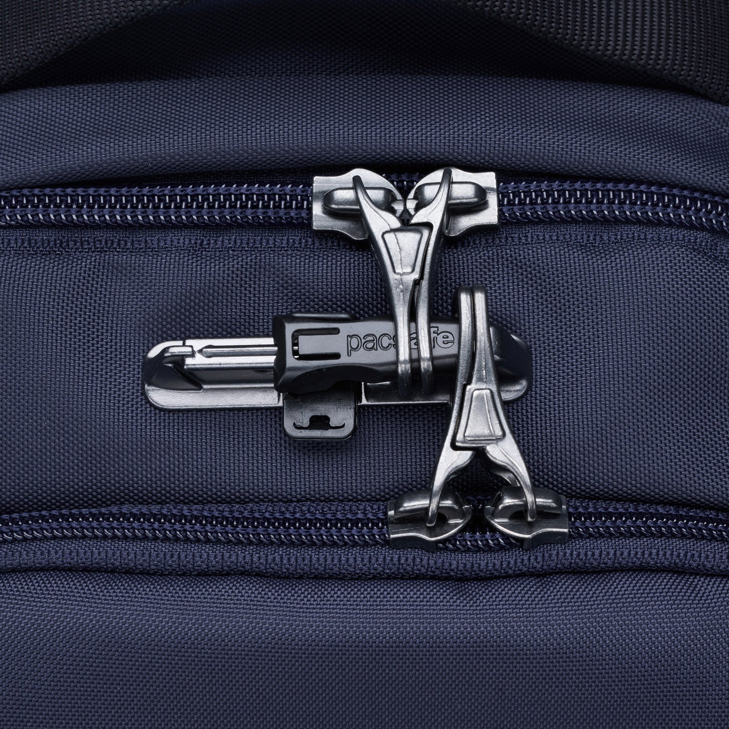 Close-up of the Pacsafe® V 16L backpack featuring a security zipper.