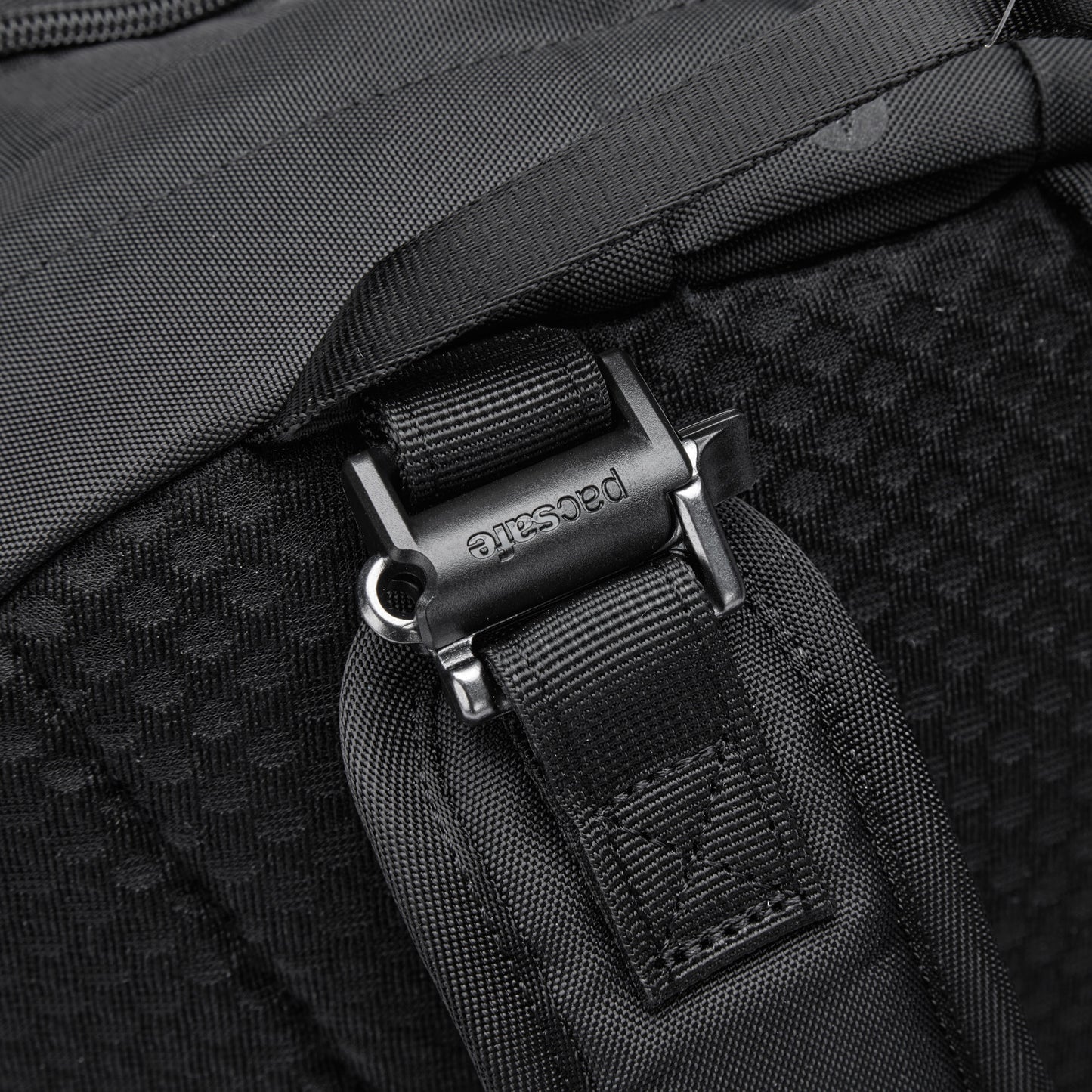 Close-up of a Pacsafe® V 24L Anti-theft Active Backpack in black with a metallic buckle.