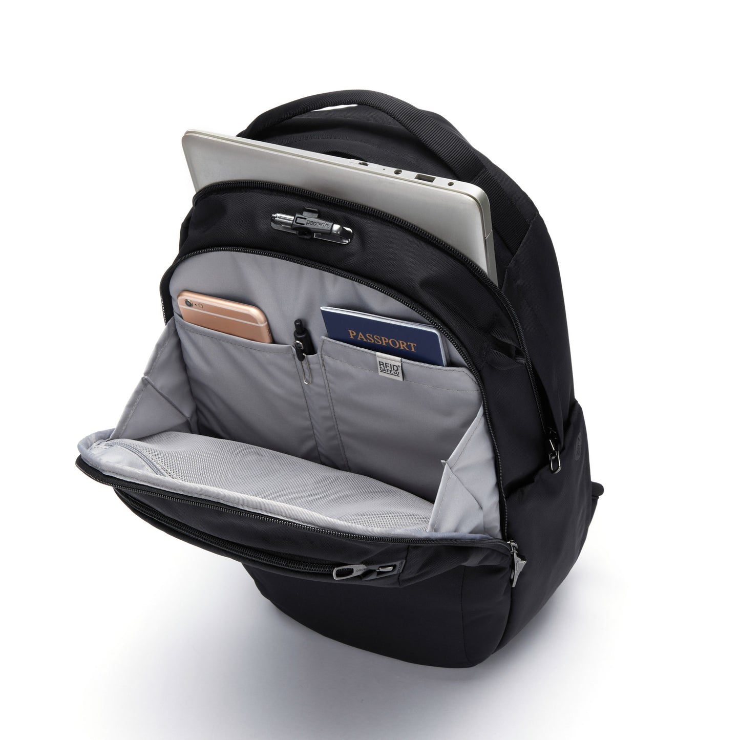 Open view of Pacsafe® V 26L Anti-theft Tour Backpack in black reveals travel essentials: laptop, passport, and phone.