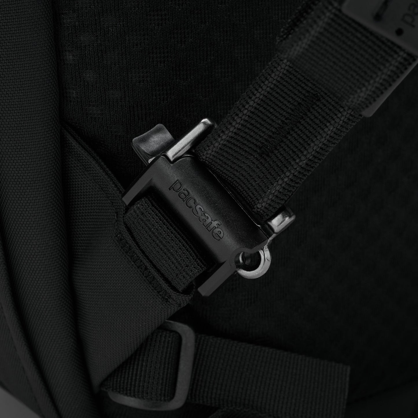 Black strap with closed buckle on Pacsafe® V 26L Anti-theft Tour Backpack, ideal for travel essentials.