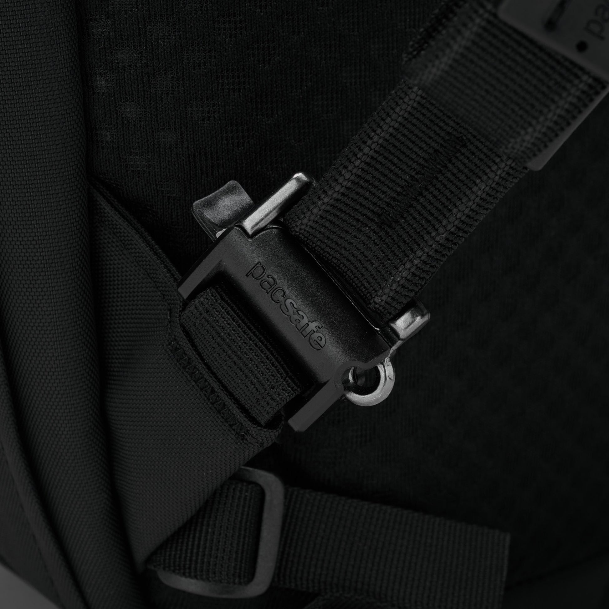 Black strap with closed buckle on Pacsafe® V 26L Anti-theft Tour Backpack, ideal for travel essentials.
