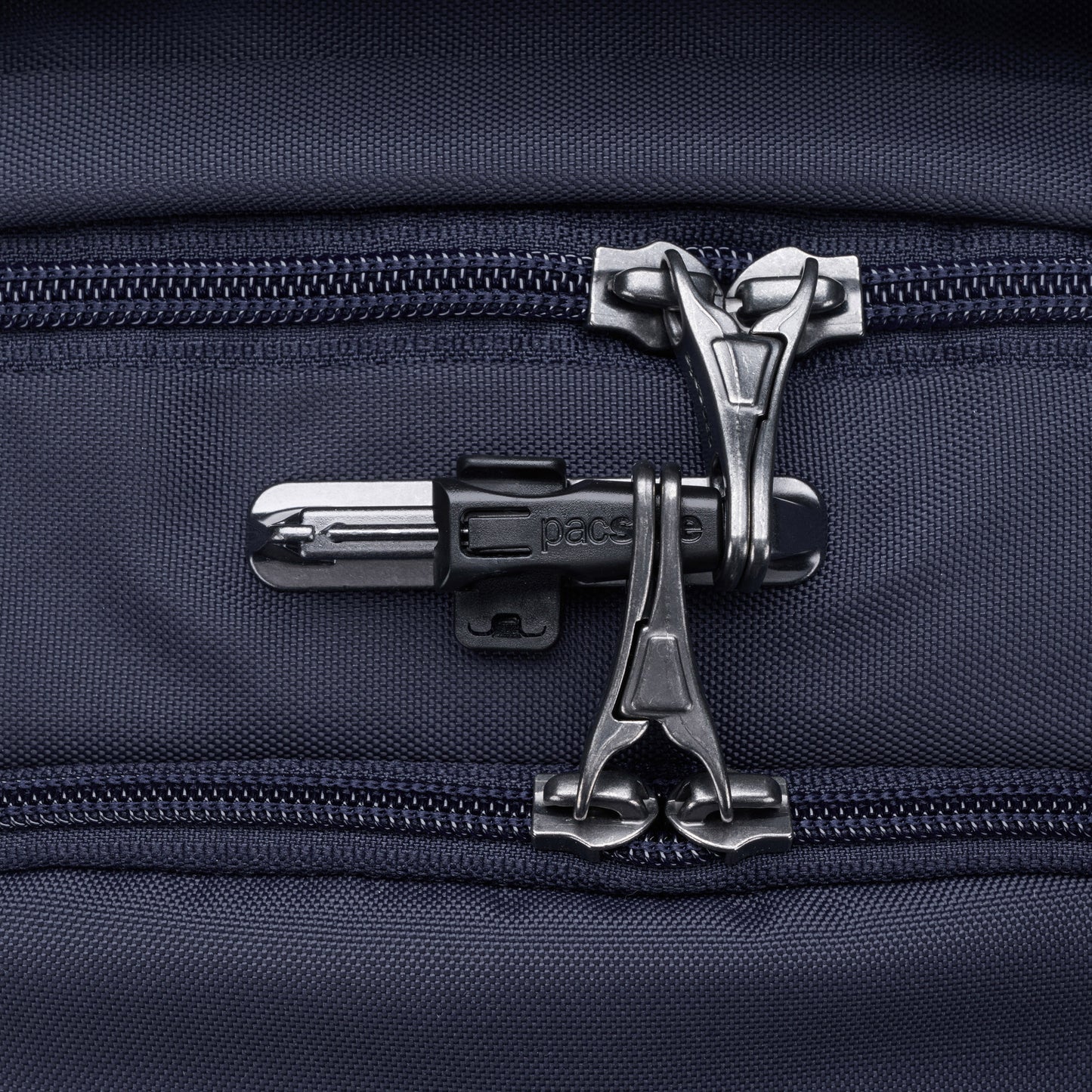 Close-up of ocean blue Pacsafe® V 26L Anti-theft Tour Backpack lockable zippers