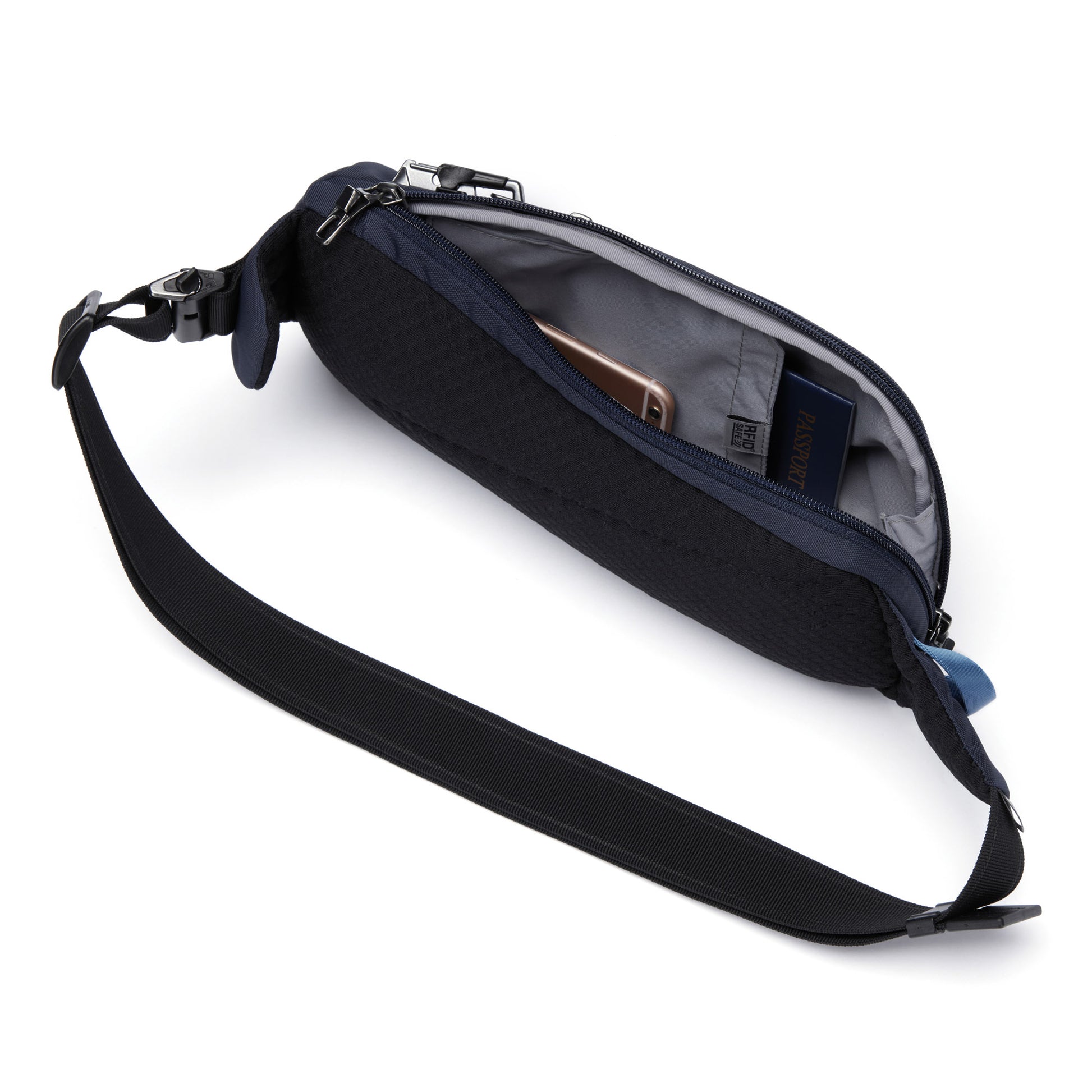 Open view of ocean Pacsafe® V Anti-theft Action Sling Pack with phone and passport inside