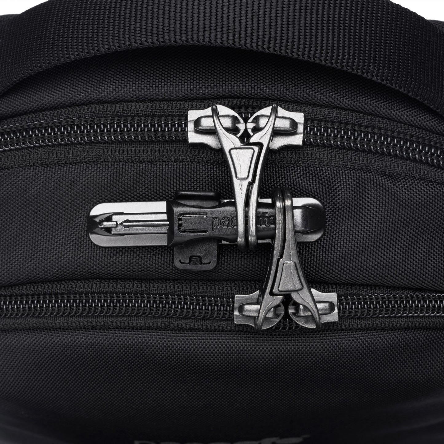 Close-up of a Pacsafe® V Anti-theft Companion Crossbody in black with silver zippers and combination lock.