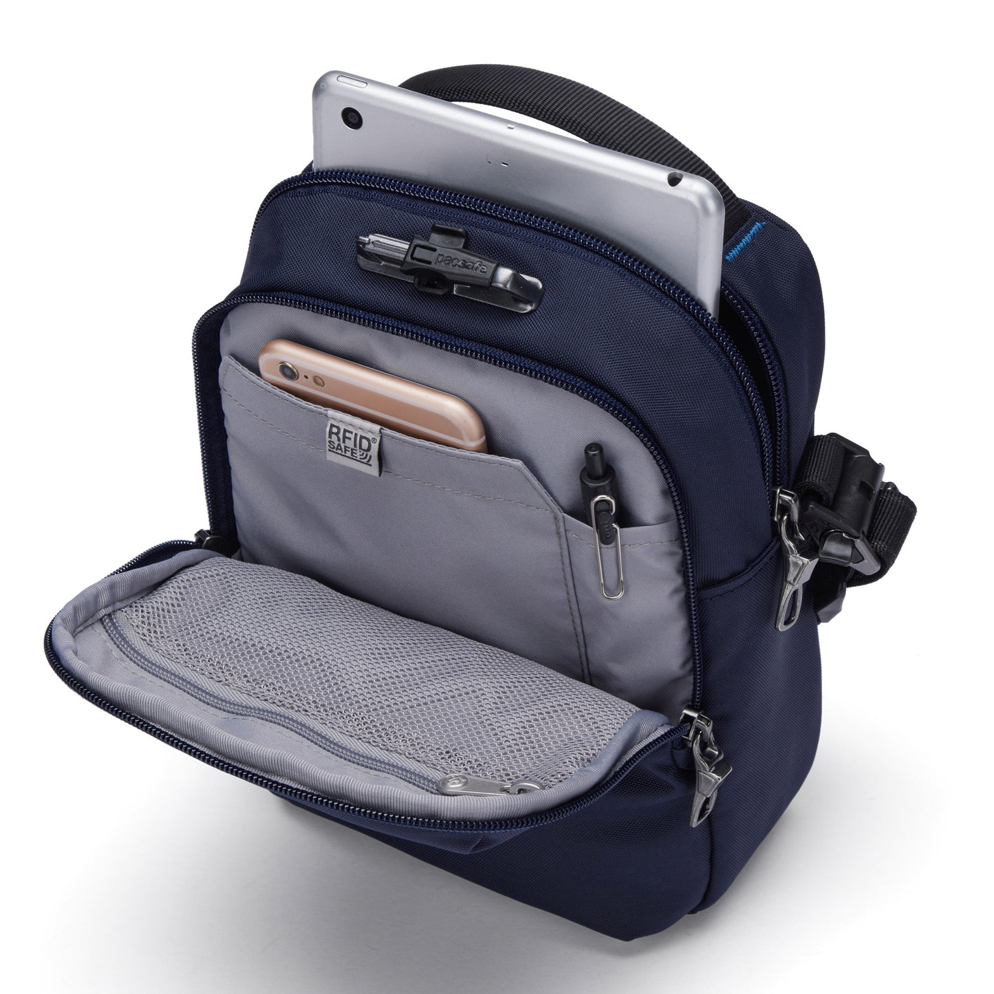 Open view of Pacsafe® V Anti-theft Companion Crossbody in ocean with a smartphone, pen, and tablet visible from its pocket.