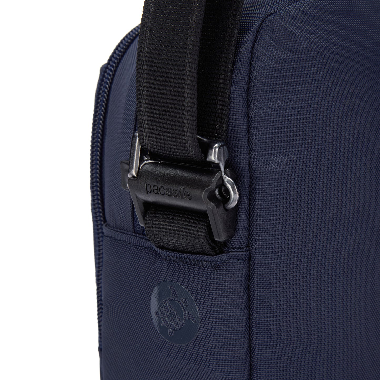 Close-up of the Pacsafe® V Anti-theft Companion Crossbody in ocean blue, with a black strap, metal buckle, and logo.