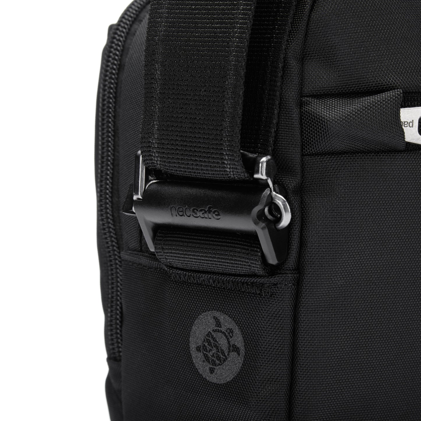 Close-up of Pacsafe® V strap with a metal buckle and turtle logo, made from recycled polyester by Pacsafe.