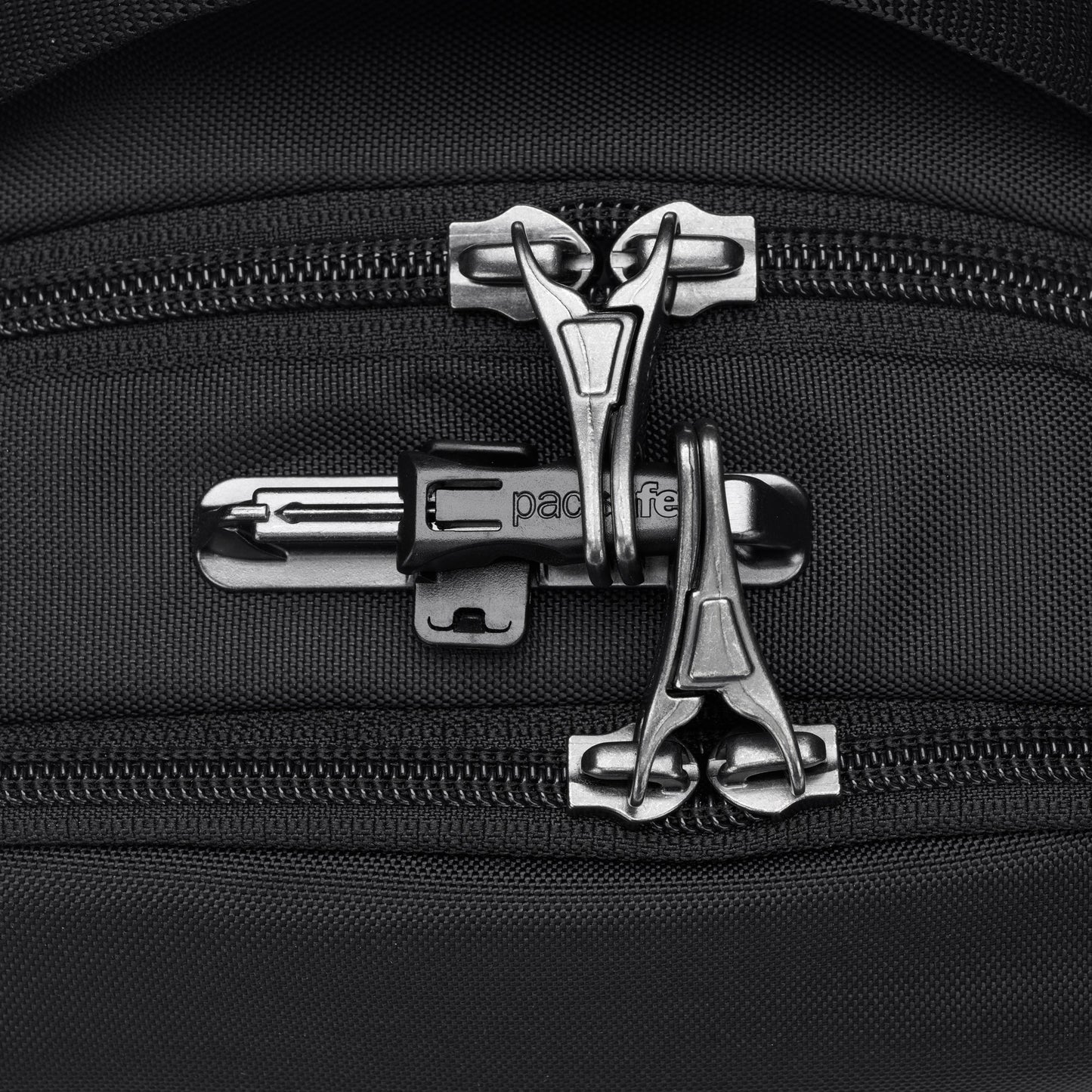 Close-up of Pacsafe® V Anti-theft Tour Crossbody with lockable zippers secured together.