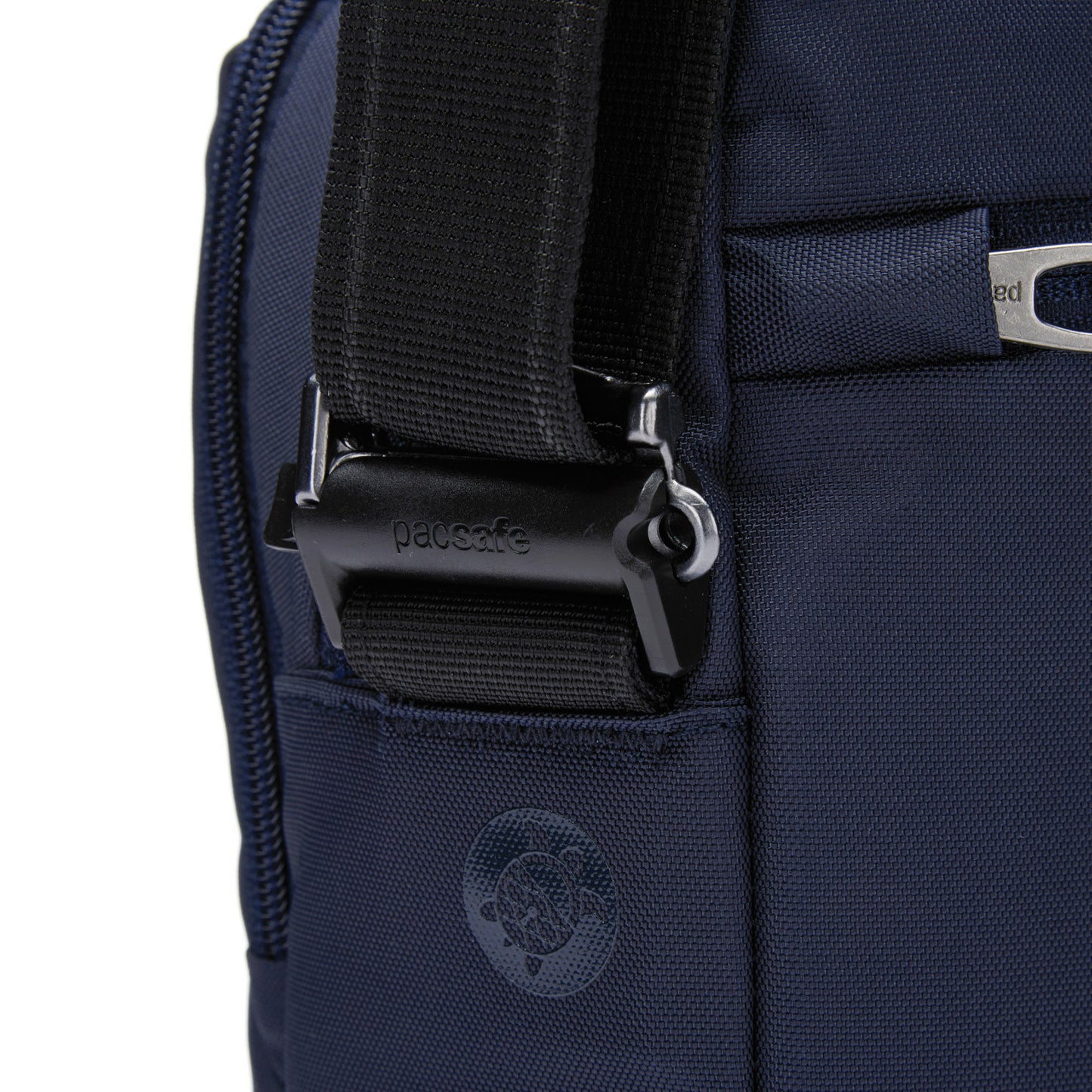 Close-up of a Pacsafe® V Anti-theft Tour Crossbody in ocean, featuring black buckle and strap, made from recycled polyester.