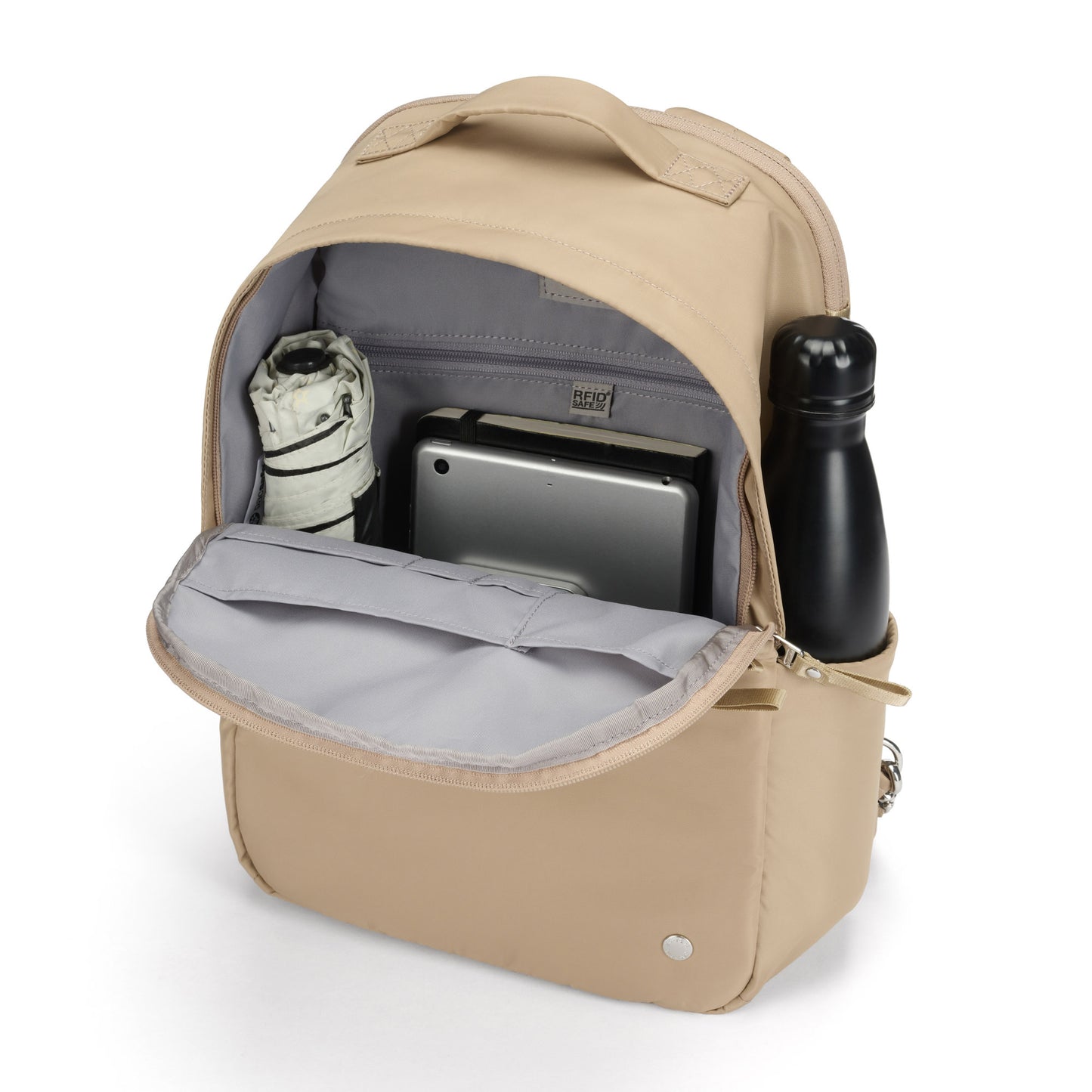 Open Pacsafe® W 10L taupe anti-theft backpack showing umbrella, tablet, and water bottle inside.