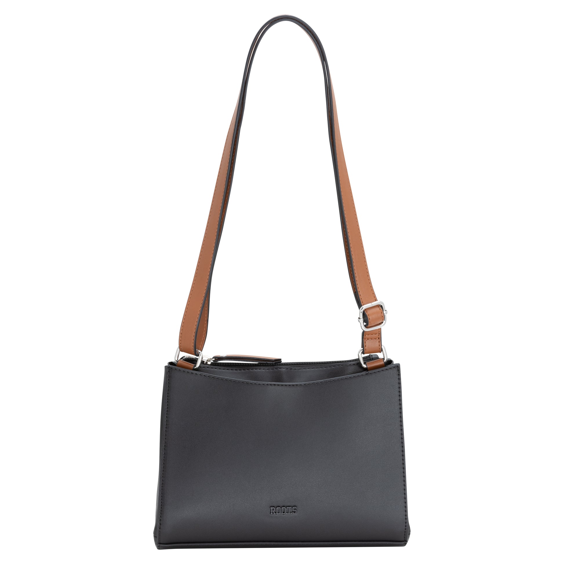 Roots Crossbody bag: black, adjustable brown strap, metal buckles, rectangular shape.