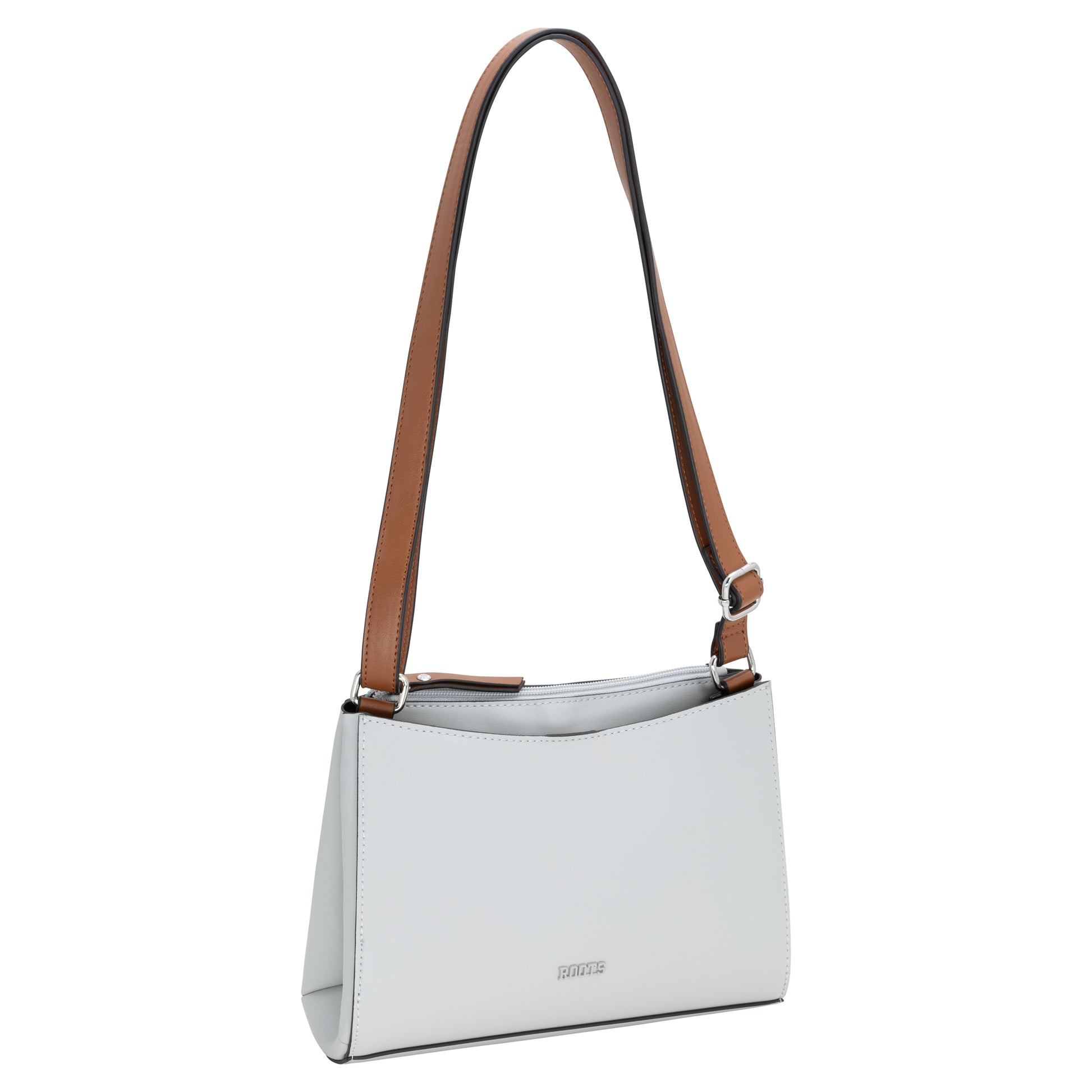 Roots Crossbody bag: light grey, brown straps, logo, adjustable shoulder strap. Front slip pocket.