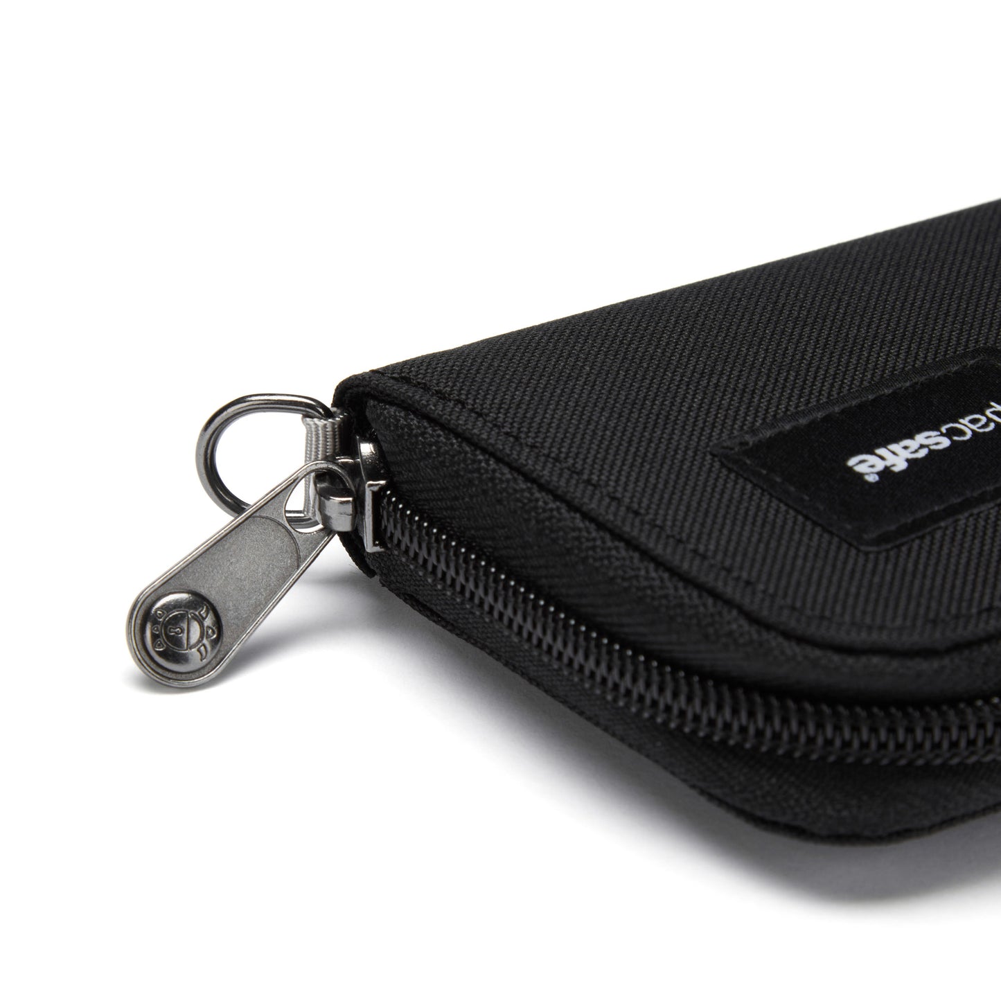 Close-up of the Pacsafe® RFIDsafe™ black pouch with metal zip, visible logo; made from recycled polyester.