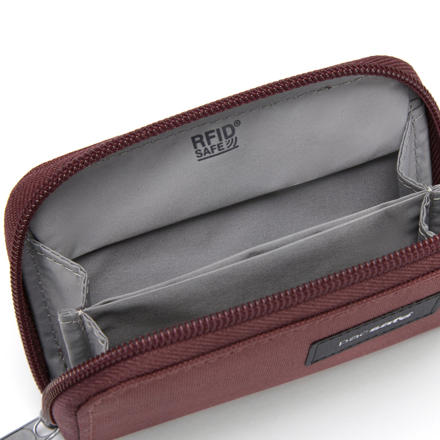 Pacsafe® RFIDsafe™ garnet red card wallet with RFID protection, two compartments, and security straps.